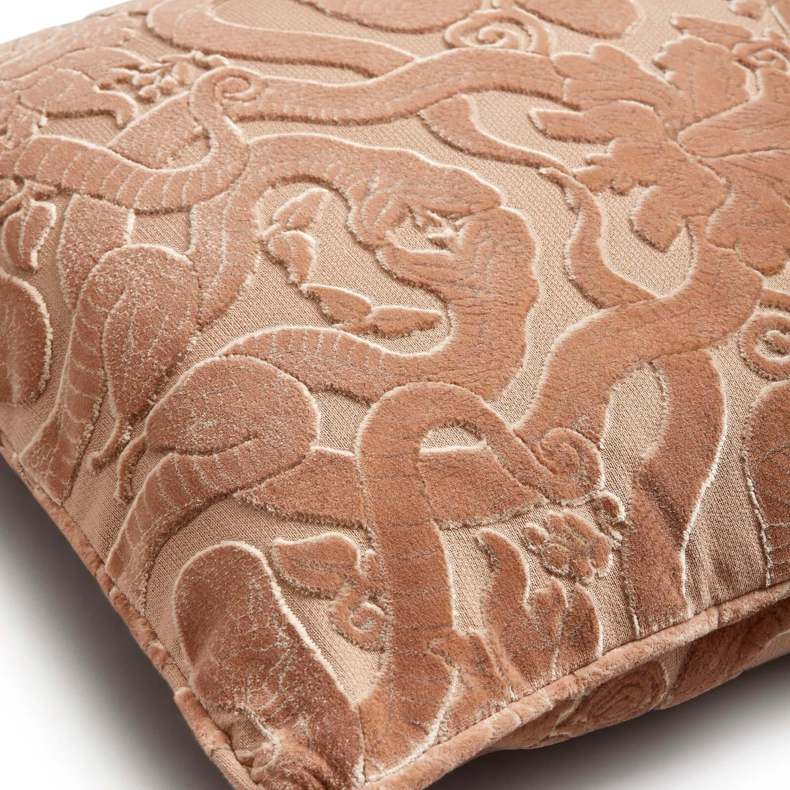While the dusky-pink tone is delicate and romantic, the ANACONDA motif of intertwining serpents (our House symbol of immortality) lies on the side of seduction and subversion. Crafted in England, this piped cushion is made from tactile cut-velvet,