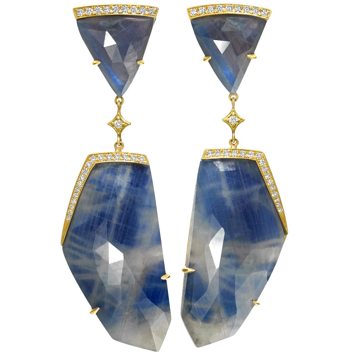 One-of-a-Kind Dangle Earrings handcrafted by jewelry artist Anahita in matte-finished 18k yellow gold showcasing four faceted blue sapphires totaling 72.0 carats with the triangle blue sapphires featuring a stunning and unique glow. Accented by 0.30