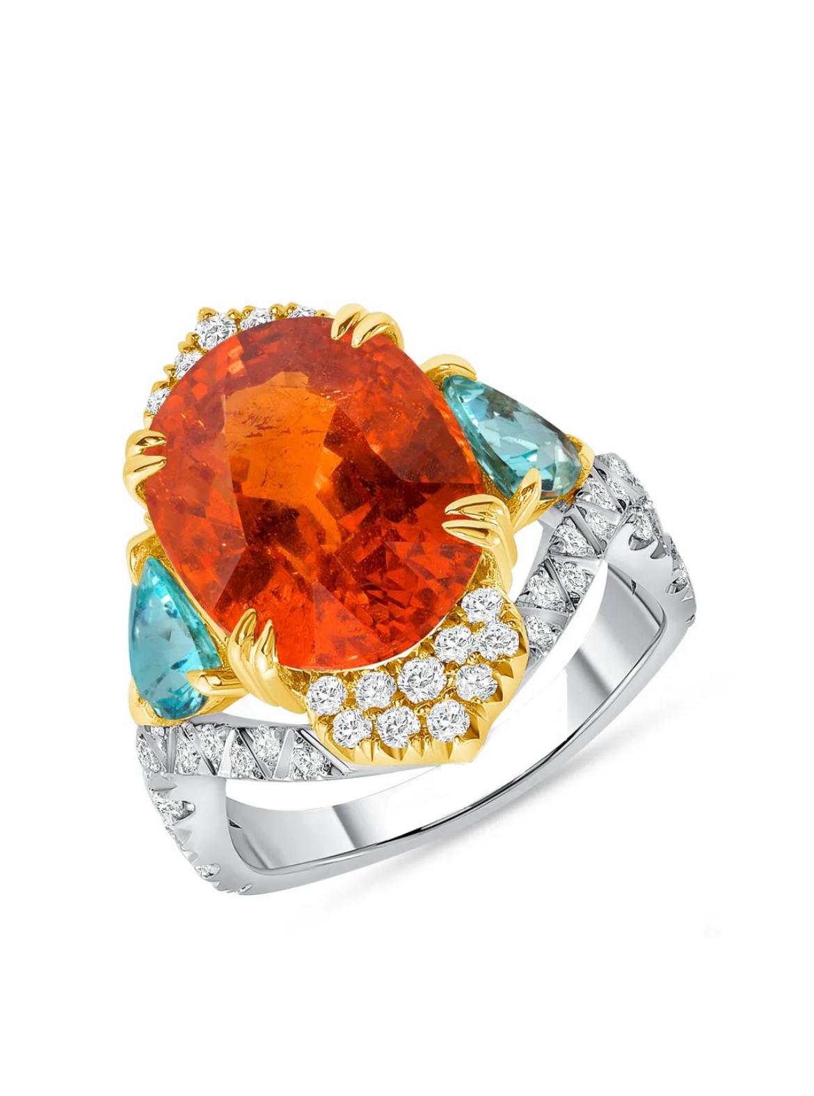 Behold the captivating allure of this  impressive 10.49-carat untreated Spessartite garnet, glowing with two Mozambique paraiba-type tourmalines totaling 1.30 carats in this marvelous ring. It is further accented by numerous round white diamonds and