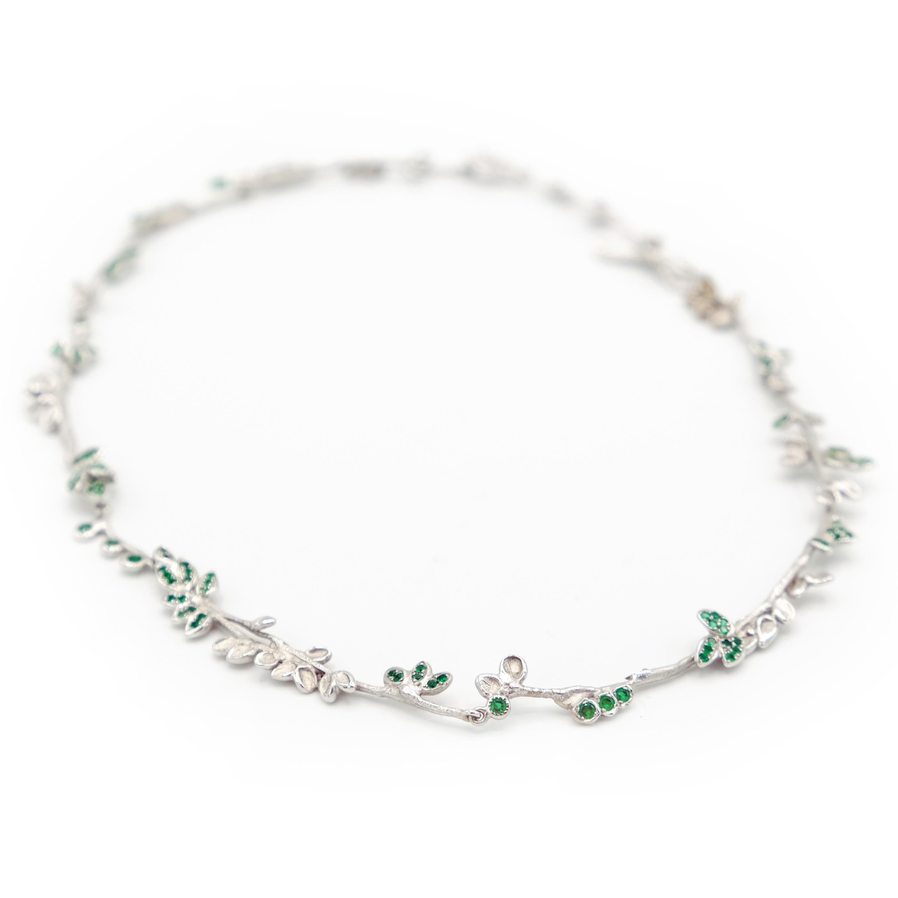 This one-of-a-kind necklace is expertly crafted by hand from 18 Karat white gold approximately 27 grams, set with glittering emeralds total 1.71 carats. 
It is entirely articulated for great comfort. It has a hand made T-bar fastening.