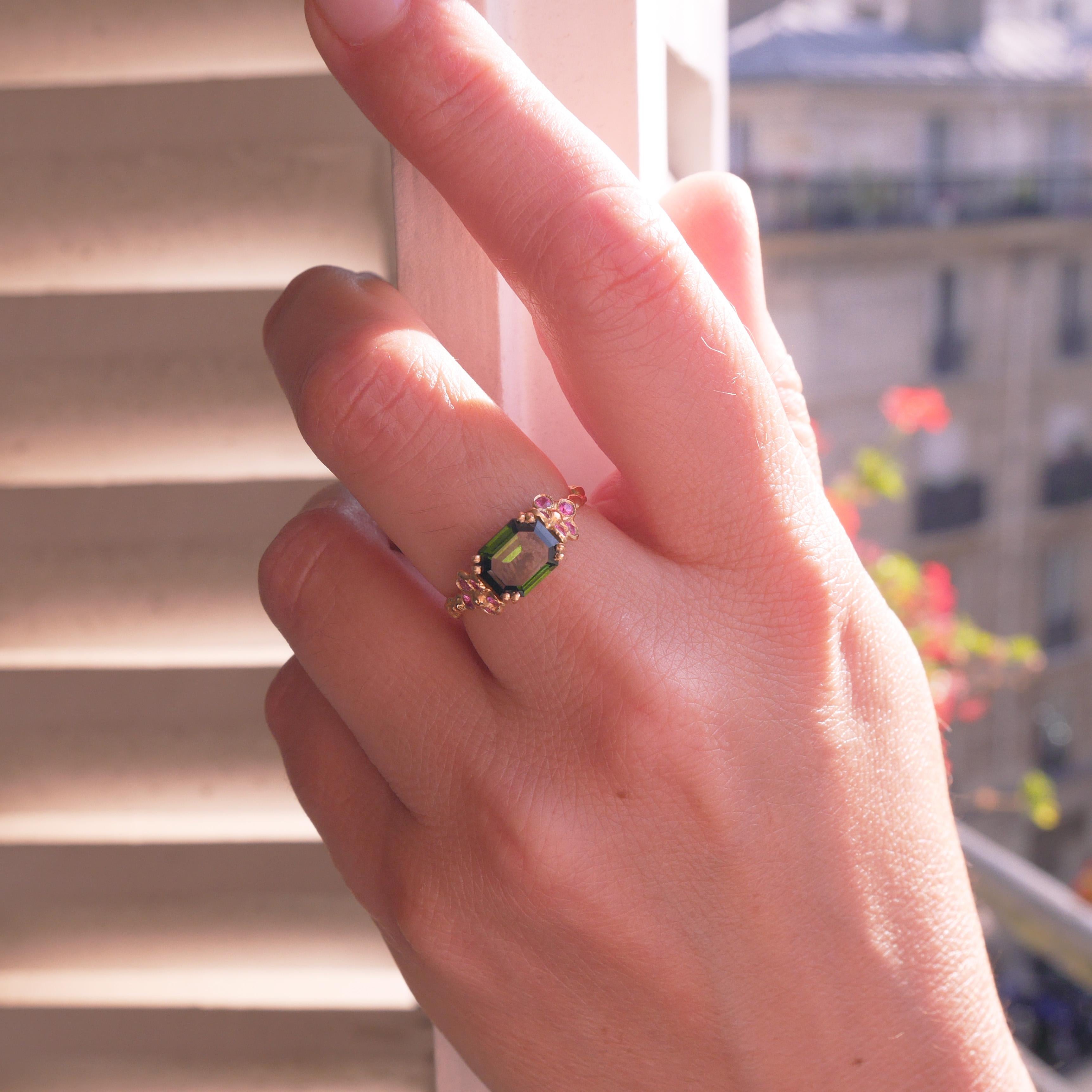 This ring is meticulously sculptured and cast from 18 Karat yellow gold and its weight is approximately 3.5 grams. 
It is set with green tourmaline and pink sapphires.
French size 54 / 6,5 US size.
It can be made to size upon request.
The