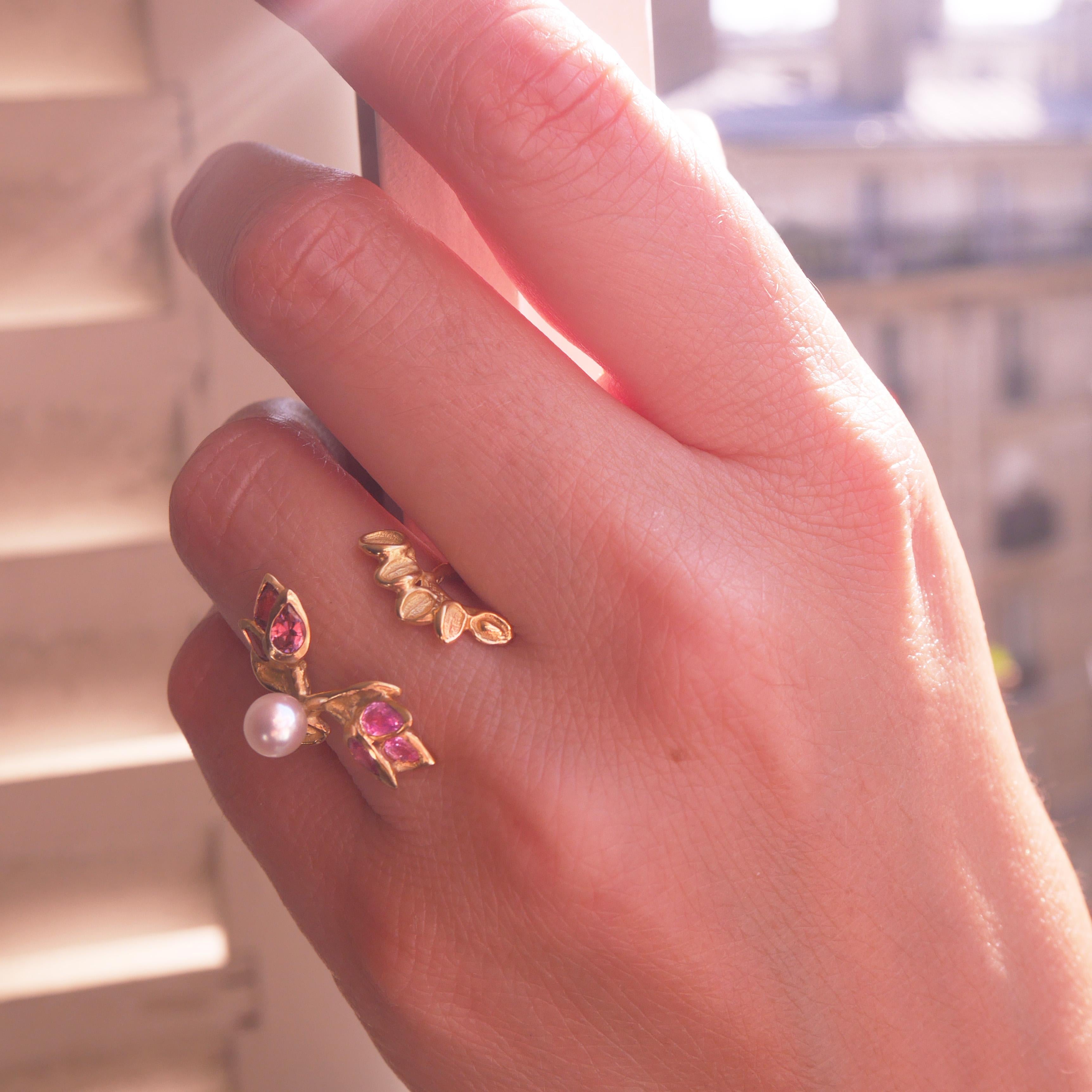 This unique sculptured handcrafted ring is made in 18 Karat yellow gold approximately 5 grams, it is designed with an elegant open silhouette set with pink tourmalines, pink sapphires and an Akoya pearl.
French size 51  / 5 US size.
It can be made