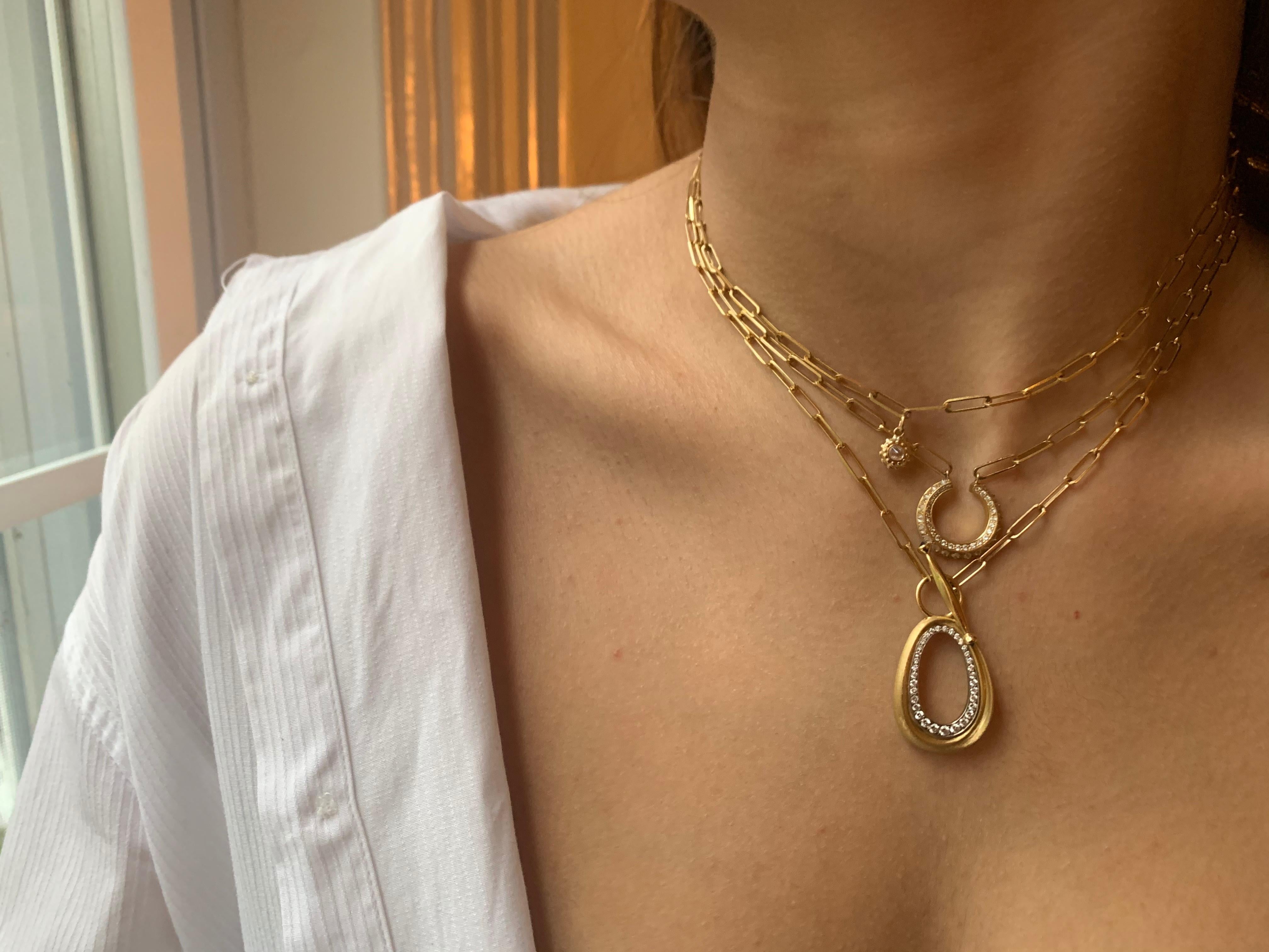 The ‘Lullaby of Broadway’ Necklace is the essence of AnaKatarina Design: sensual femininity with an attitude. The stone etched yellow gold drop is sculpted to form a convex to concave circle creating flirtatious movement.  The seductive oval is