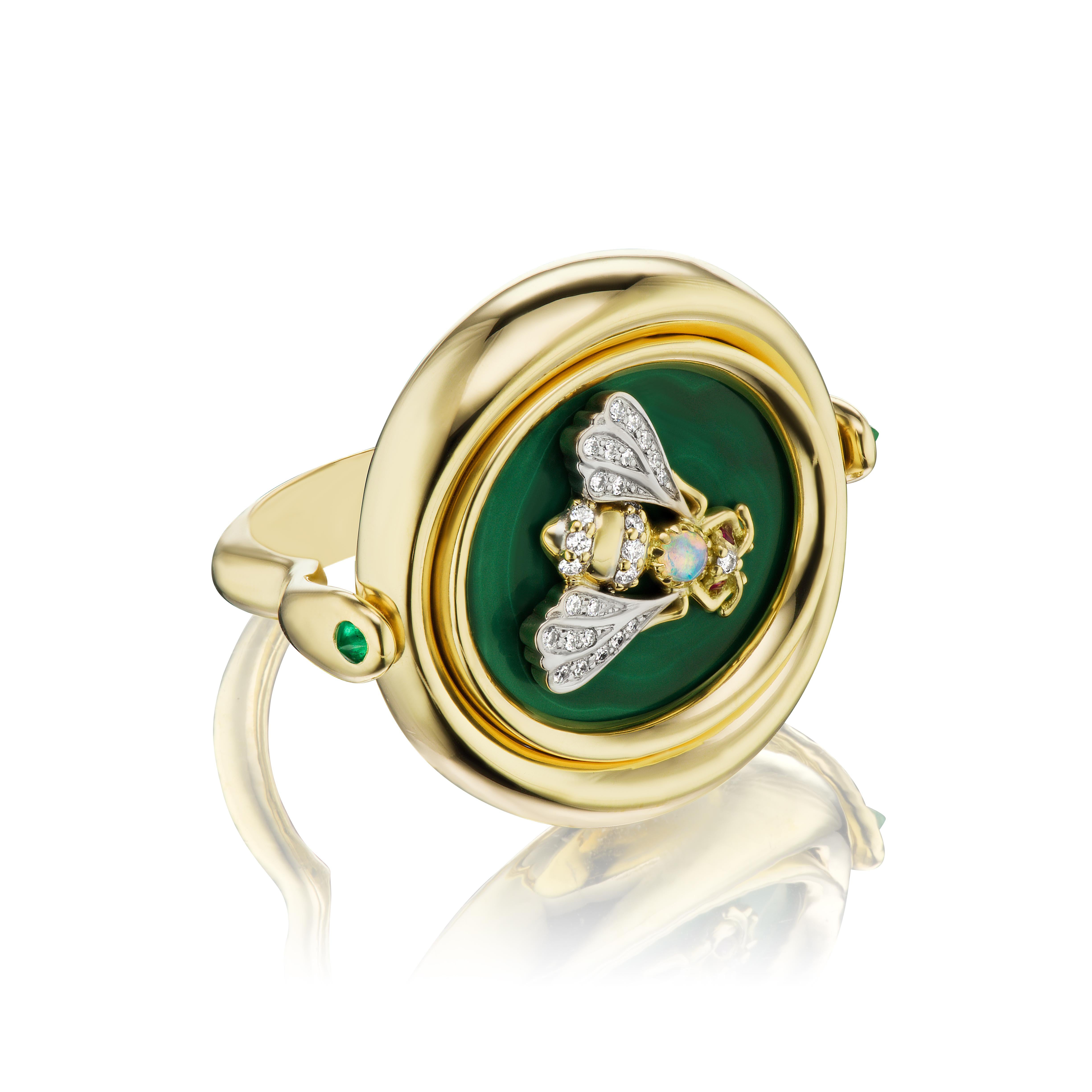 18k Yellow & White Gold, Malachite, .30ct Emerald, .03ct Ruby, .03ct Lightning Ridge Black Opal

Design Inspiration

The Earth Flip Ring is a statement ring that flips to reveal a diamond tree of life. You have the option to wear the ring as a