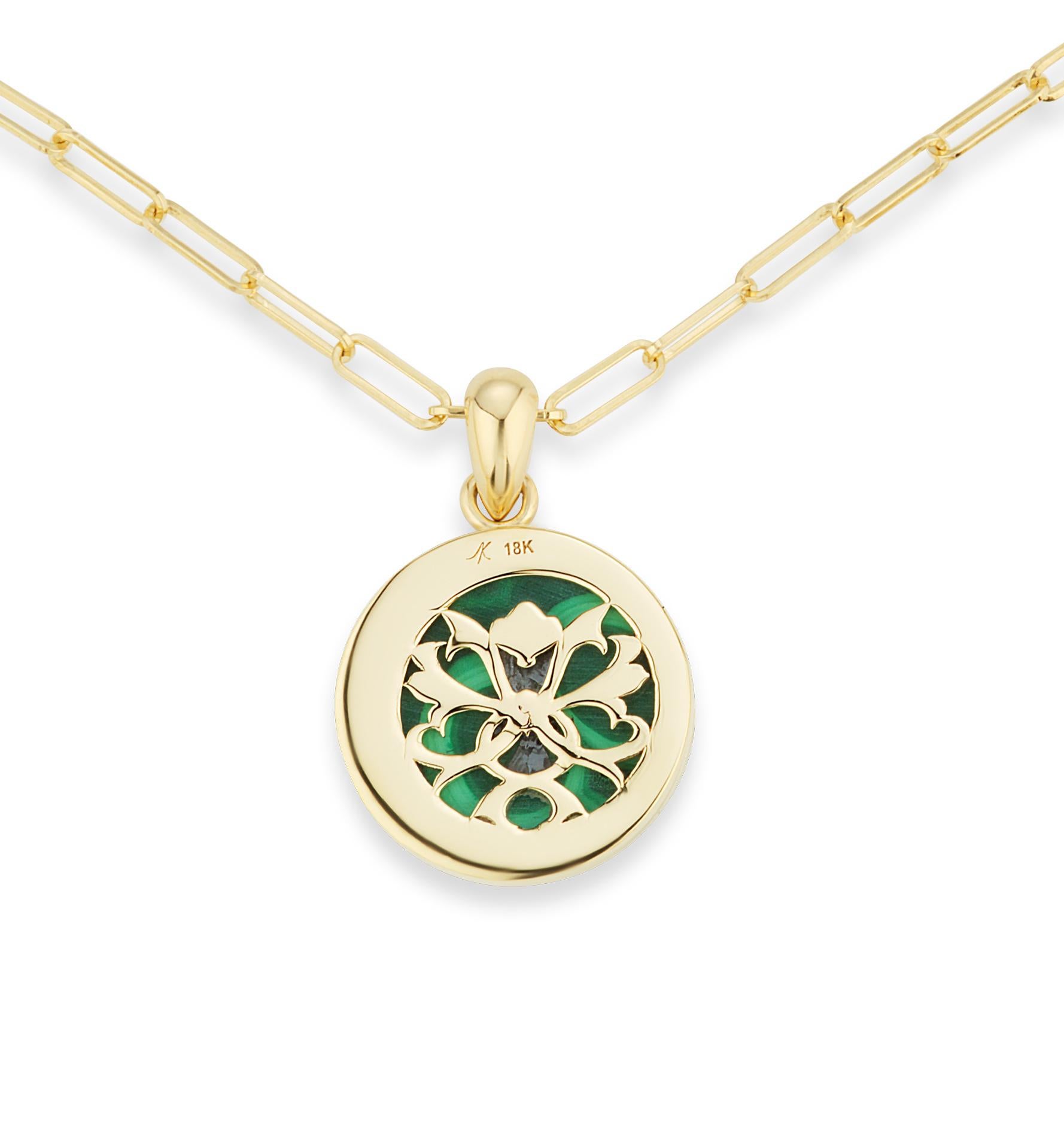 The Four Elements Earth Pendant is an expression of the abundance of our mother earth and reverence to the bumblebee. An 18k yellow gold bee, with ruby eyes, and black enamel stripes, is suspended over malachite.  This pendant decadently flips over,