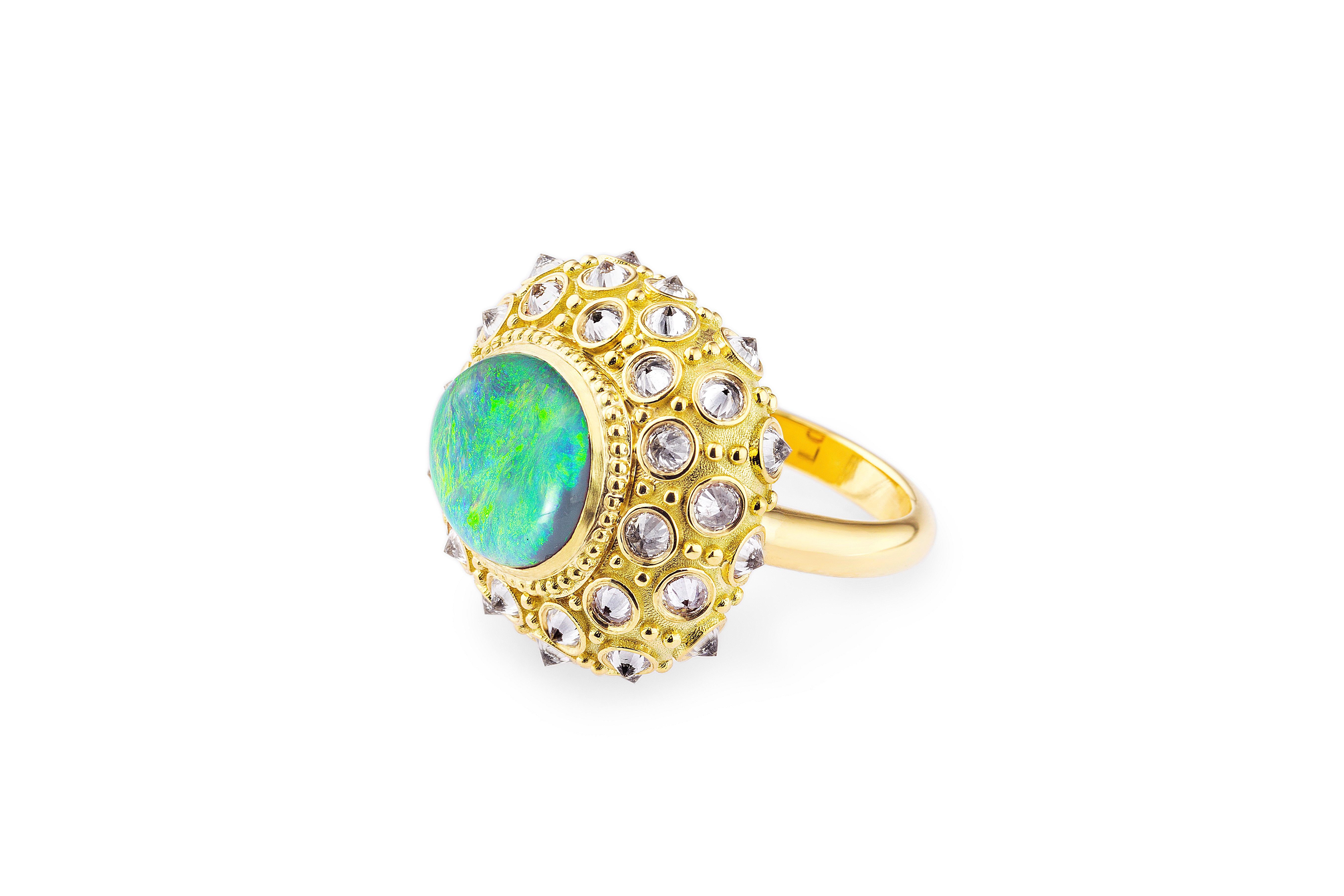 AnaKatarina’s ‘Beyond the Sea’ ‘Ring is an homage to the beautiful sea urchin and its totem of intuition and evolution. This beautiful work of art is one-of-a-kind. A Lighting Ridge black opal adorns the center of the sea urchin surrounded by