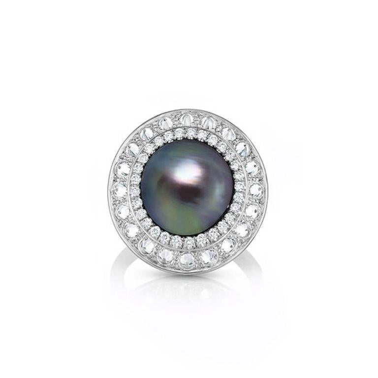 'I PUT A SPELL ON YOU' RING

A sculptural circle with dual halos of diamonds surrounding a distinctive Sea of Cortez pearl. The inner ring is set with pave diamonds while the outer ring is set with inverted set diamonds. No two Sea of Cortez pearls