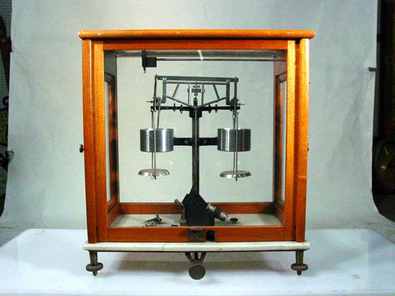 Hand built analytical beam balance scientific scale. The scale is used to measure both solid and liquid masses (10/100g capacity). Highly sensitive silver cylinders dampen the harmonic motion of the beam balance.

 