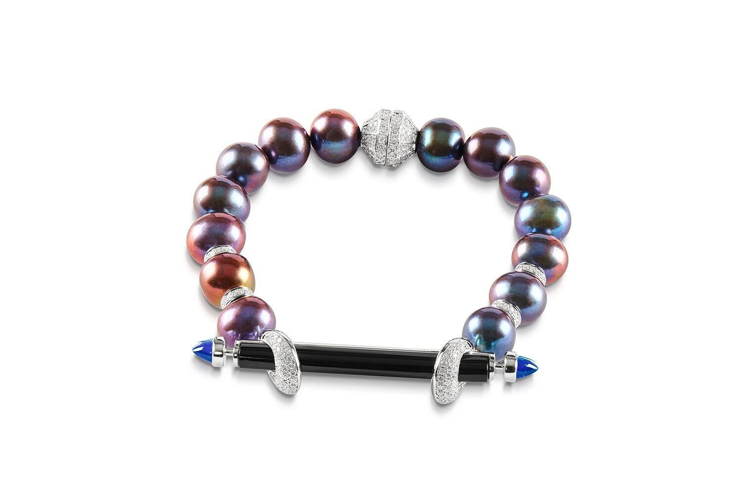ANANYA CHAKRA BRACELET SET WITH ONYX, TOPAZ, PEARLS AND DIAMONDS


Set in 18K White gold


Total diamond weight: 1.50 ct
Color: F-G
Clarity: VVS1

Total cabochon topaz : 0.59 ct

Black freshwater pearls
Diameter - 50 mm