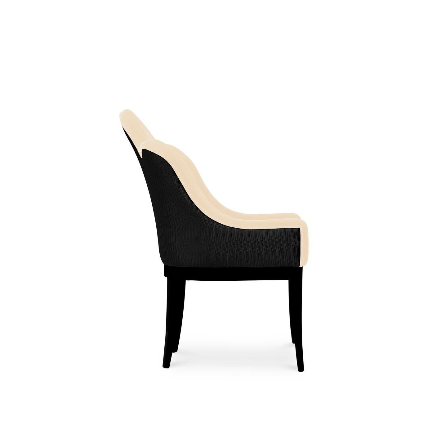 Add a daringly stylish essence to your dining room design with the audacious Anastasia dining chair. She surpasses the traditional elegance of a fully upholstered dining chair with the modern allure created by the luxurious curves and bold lines
