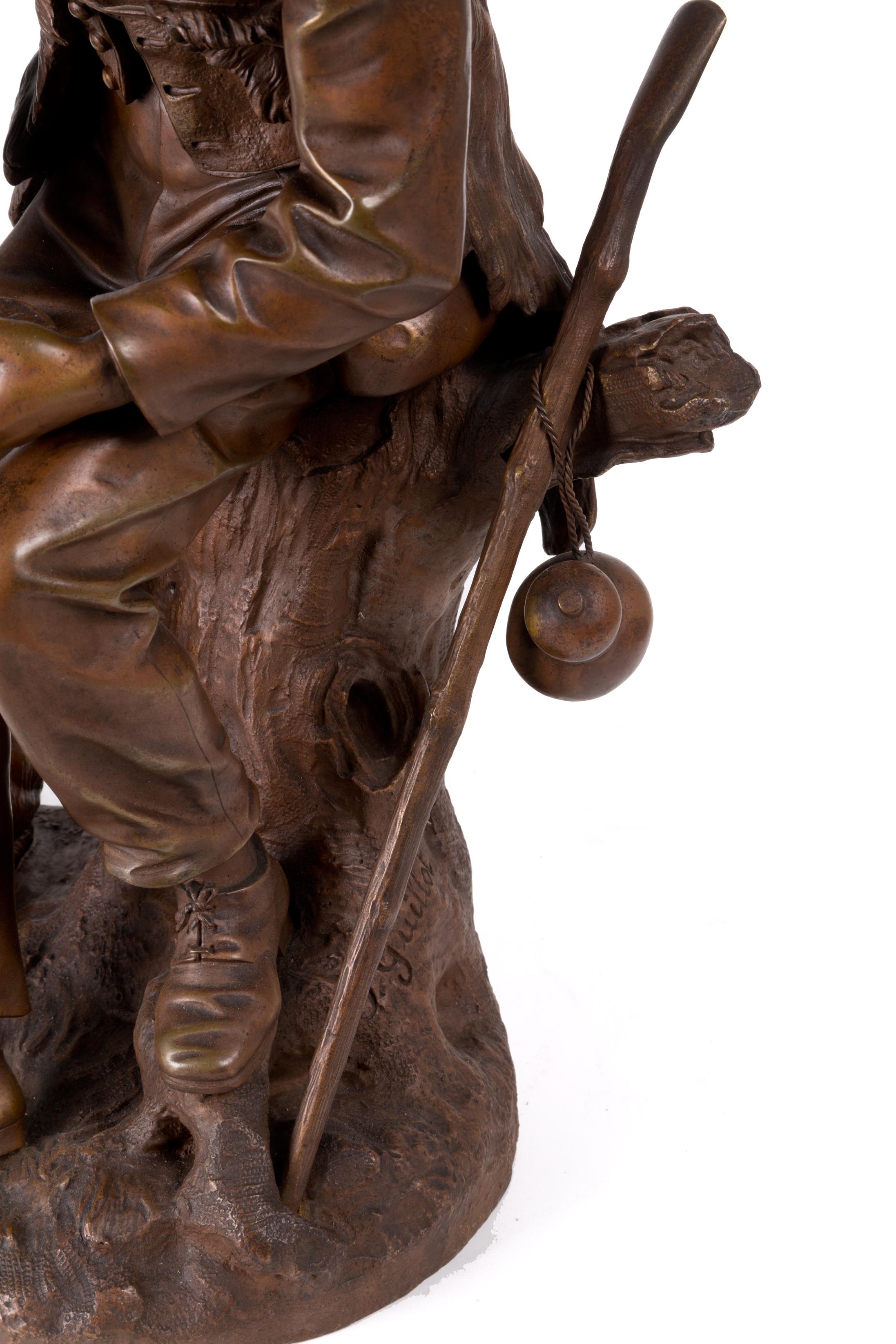 Bronze Sculpture en bronze d'Anatole J. Guillot représentant « un sculpteur sur bois assis avec un chien » en vente