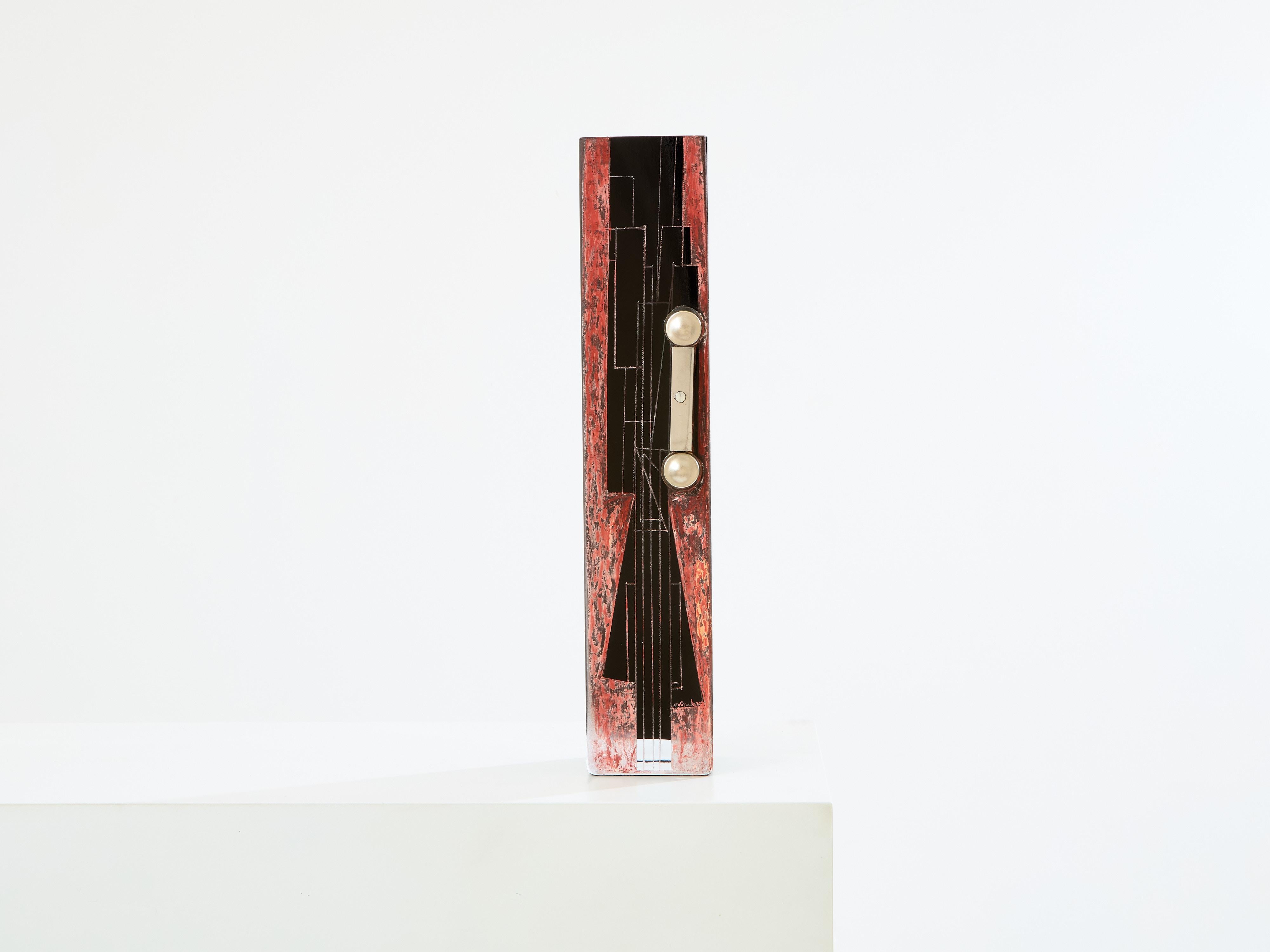 This tall Art Deco vase in black opaline glass, with engraved details, red painted decor, and chromed steel pieces add-ons, is signed by the Russian artist Anatole Riecke, and dated 1938. As the Master Glassmaker of La Coupole in Paris, he was