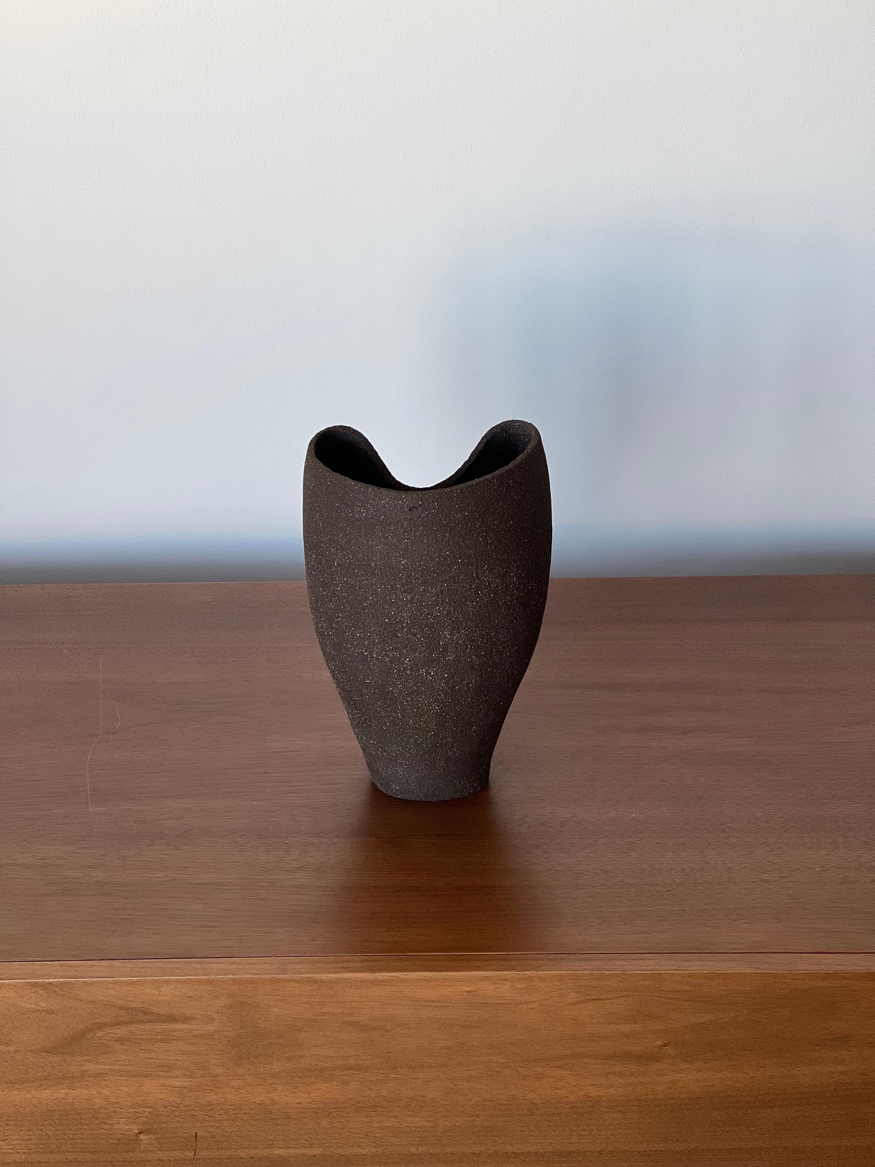 Anatolian 3 Vase by Güler Elçi
Dimensions: W 15.2 x D 12.7 x H 24.1 cm.
Materials: Stoneware Ceramic.

Güler Elçi is a ceramic artist based in Istanbul. In the light of her engineering career, she considers ceramics as a material and likes to push