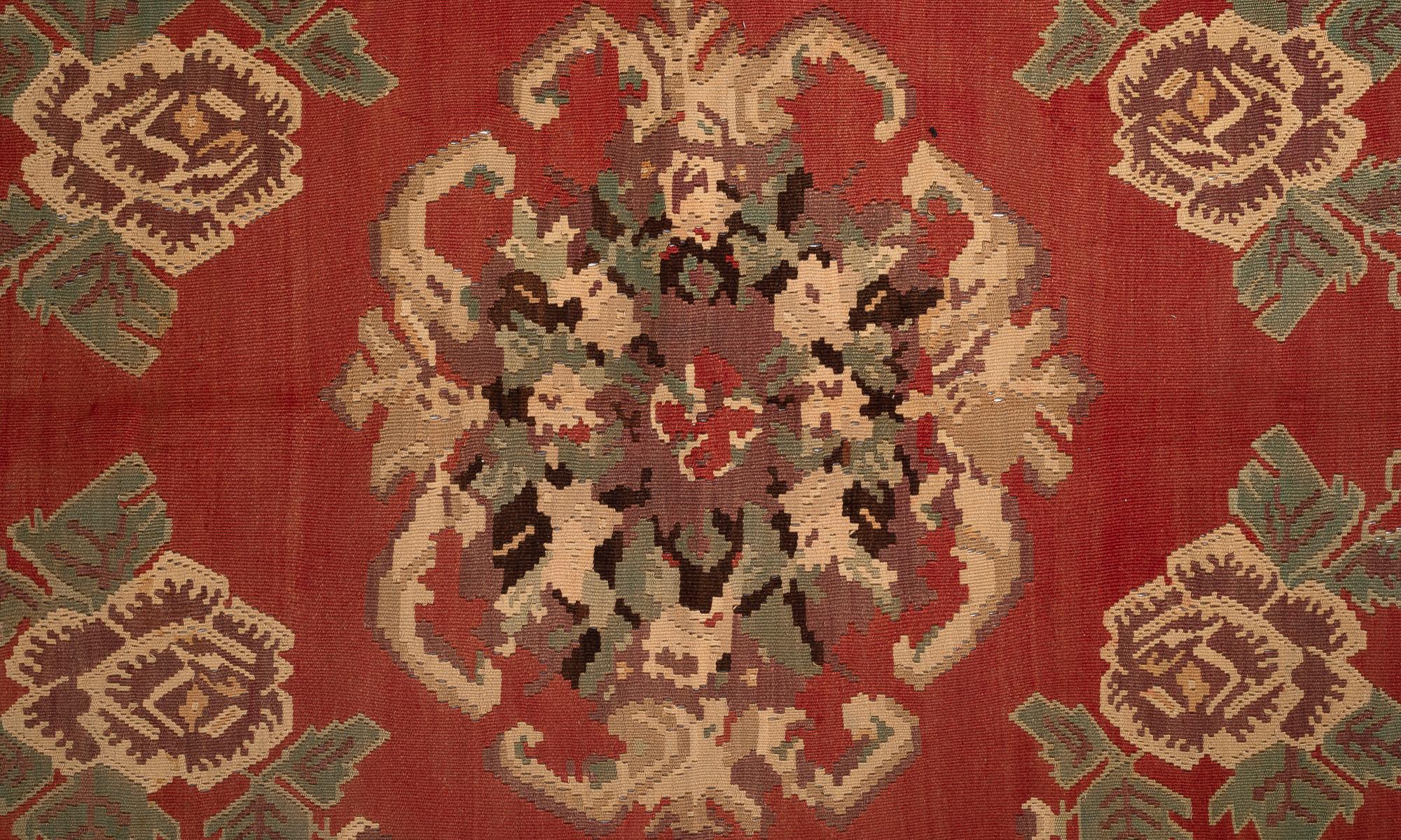 Anatolian Gochem Floral Kilim, circa 1950

Elegant and highly detailed geometric floral motif in reds and browns.