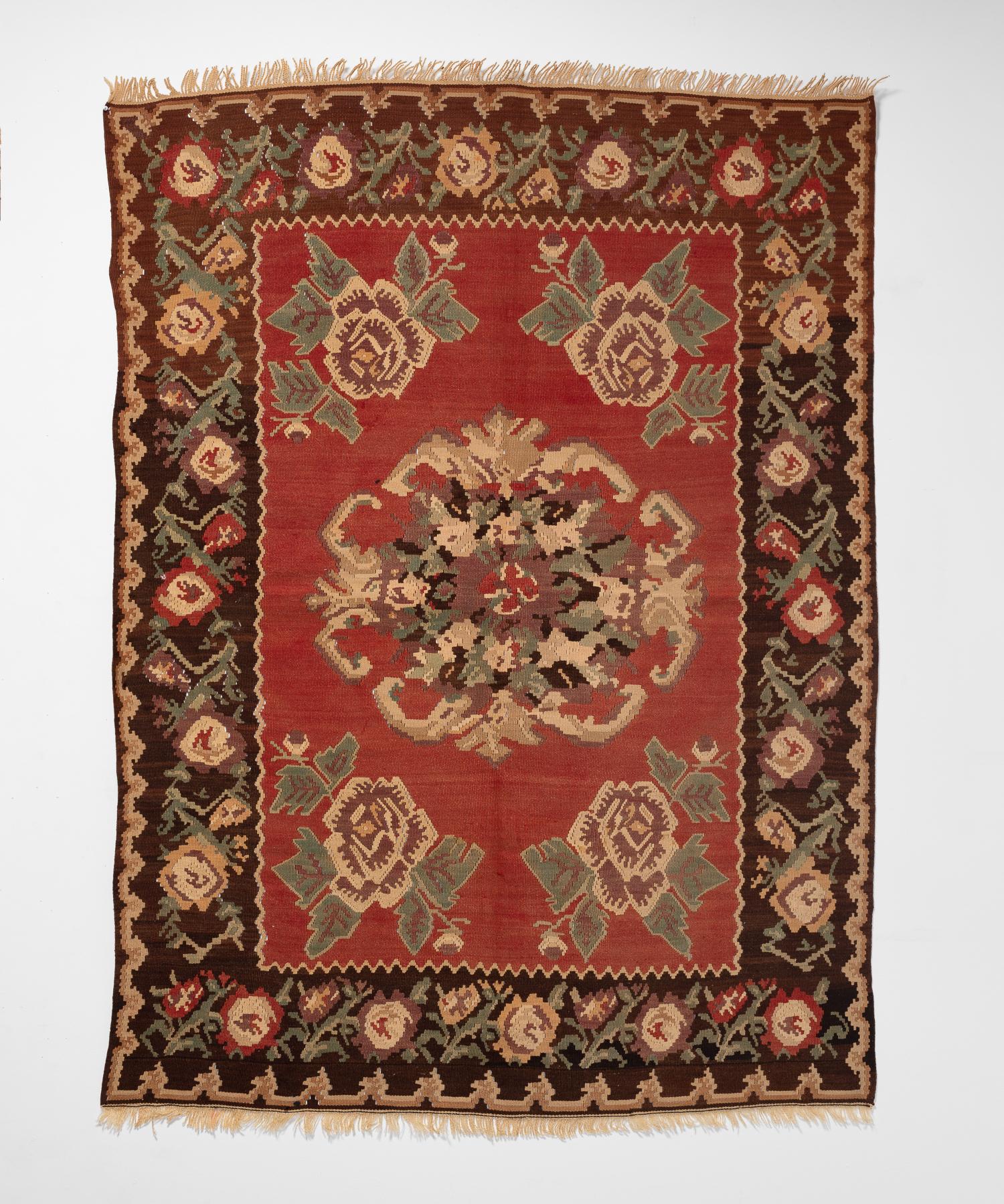 Anatolian Gochem Floral Kilim, circa 1950

Elegant and highly detailed geometric floral motif in reds and browns.