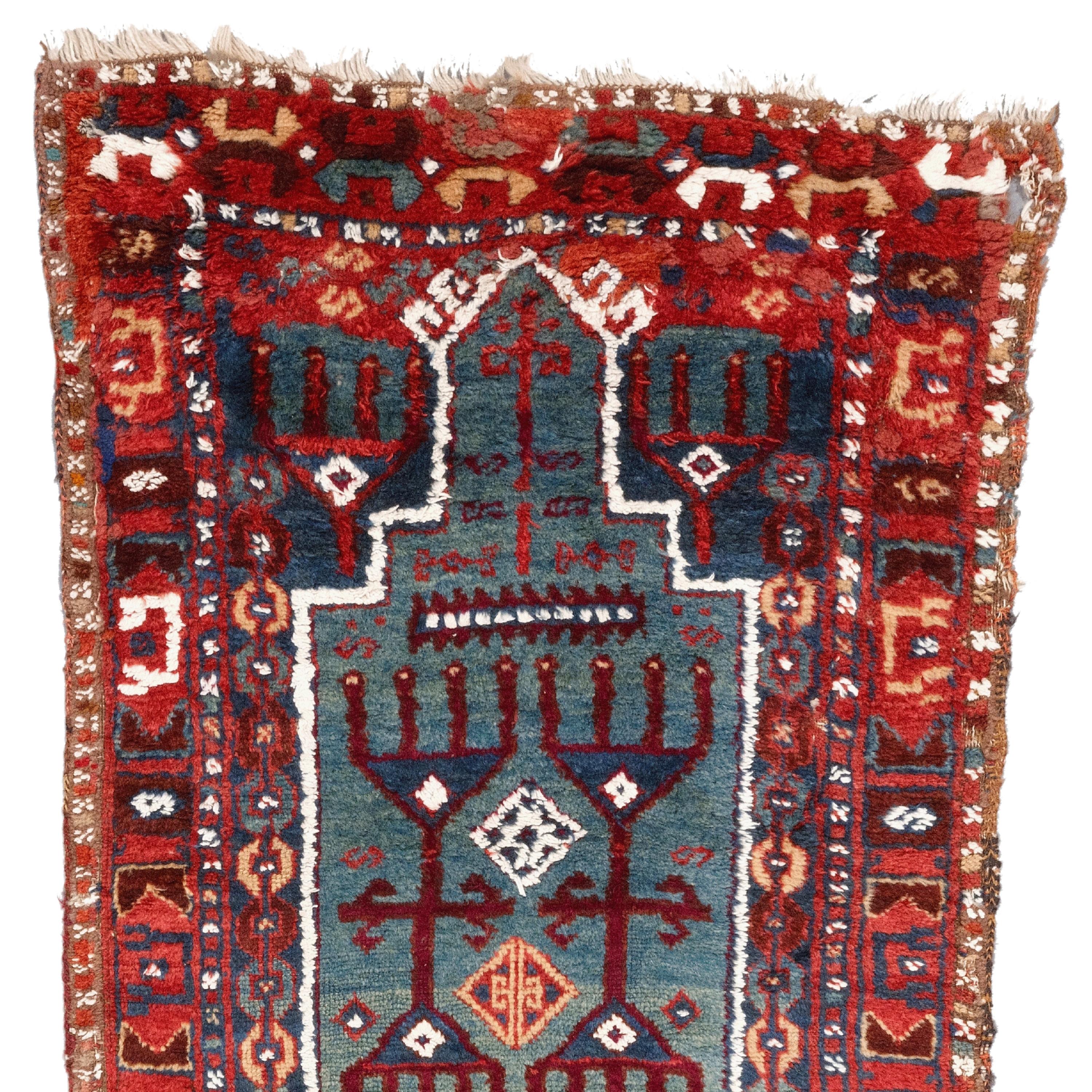 19th Century Anatolian Kurdish Prayer Rug

This extraordinary carpet will fascinate you with its intricate designs and vibrant colors that reflect the rich history and craftsmanship of the period. Each stitch tells the story of skilled craftsmen who
