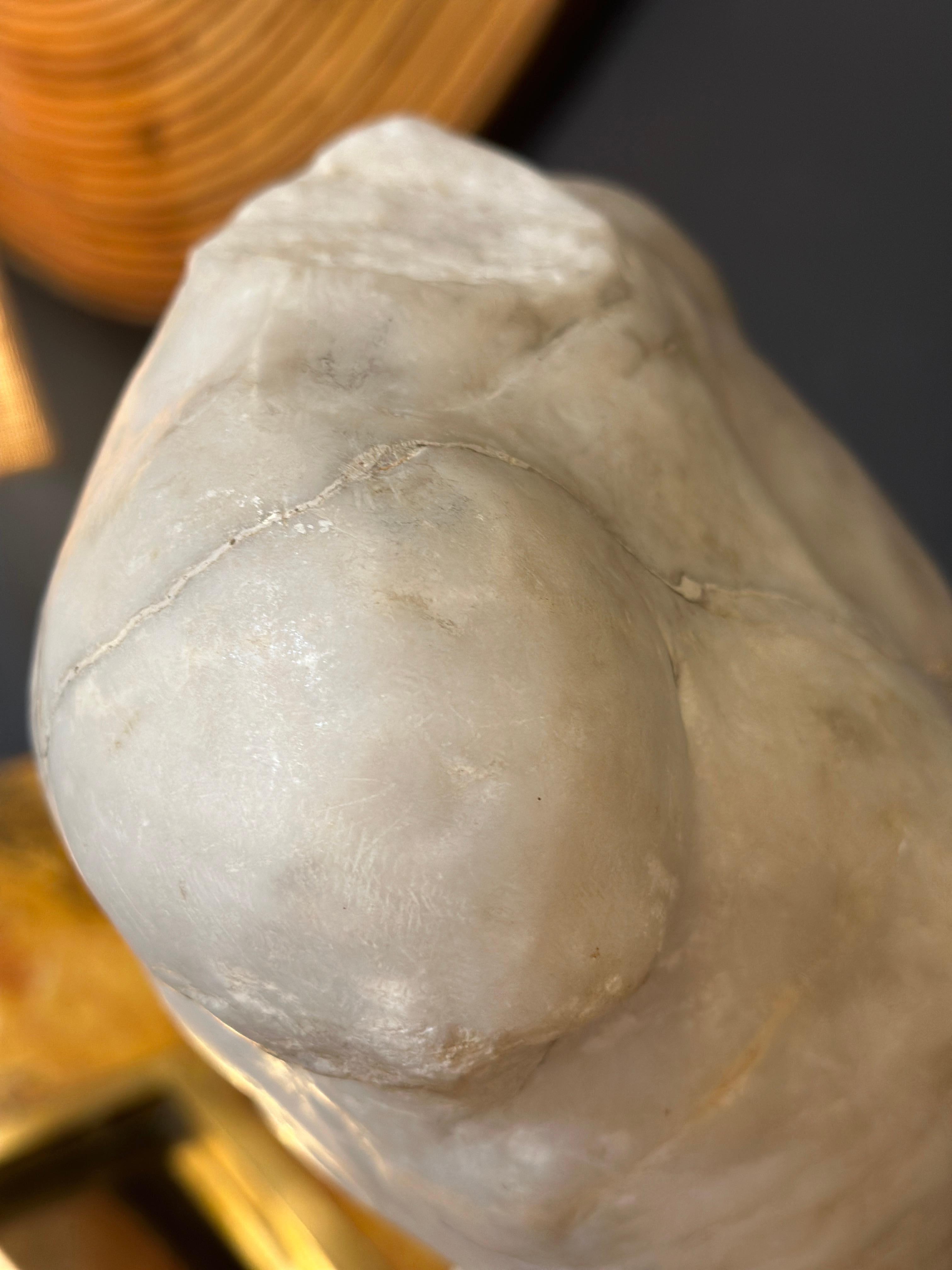 The figure’s head is slightly tilted, giving it an expressive look, and the torso is sculpted to reveal muscles and tendons, giving insight into the human body’s structure beneath the skin. This type of anatomical model is often used to study the