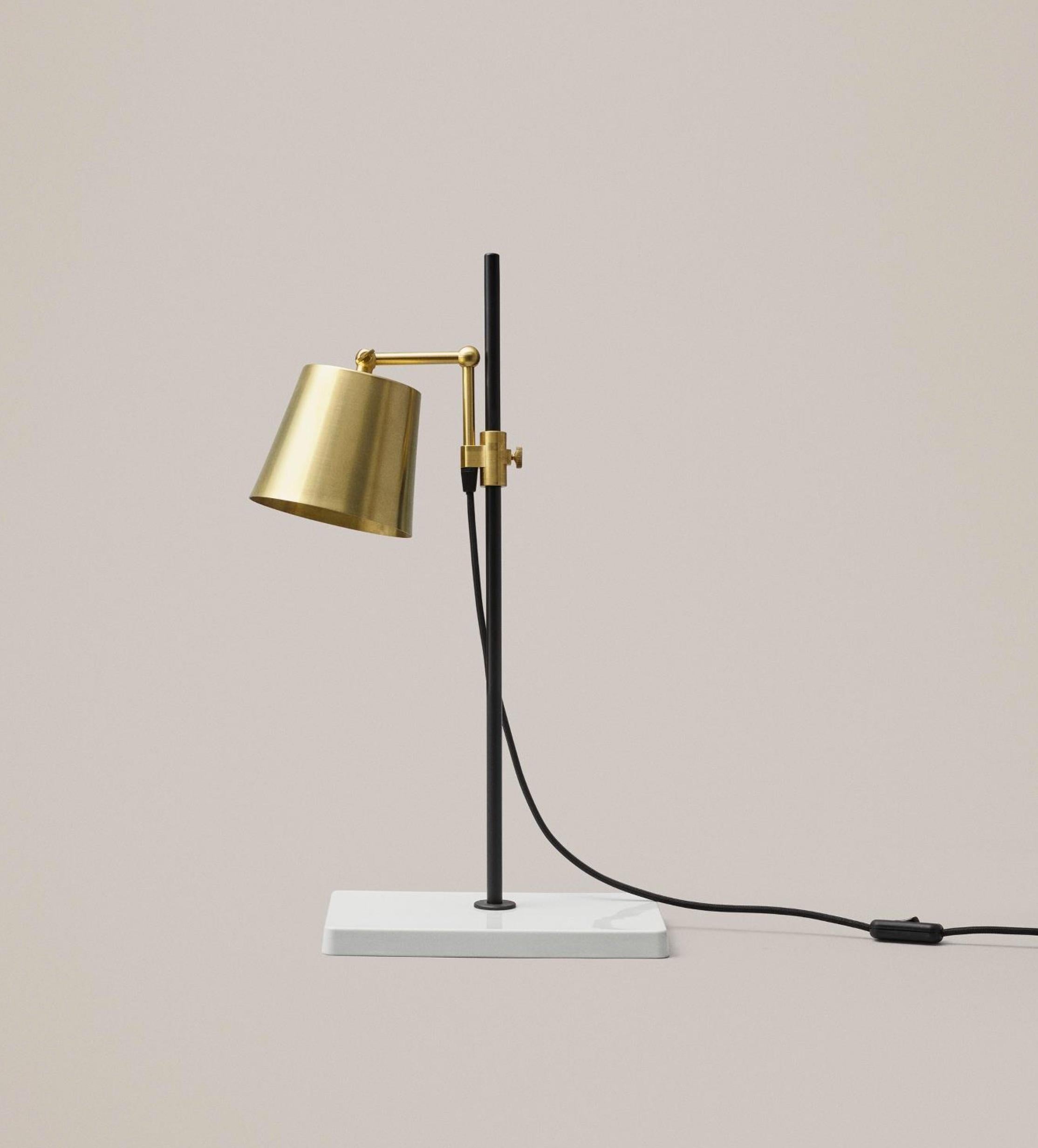 The lab light design came about from a genuine fascination with laboratory equipment and with all those fantastic clamps and levers — the perfect place to start designing a multi-functional lamp.

The base is porcelain, the stem is painted steel,