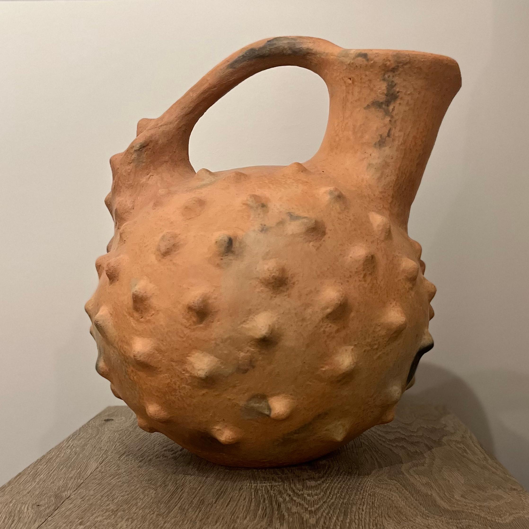 Jarron con Picos. A large terra-cotta clay vase from Oaxaca, Mexico. Drawing on ancient techniques and forms, the vessel is an extension of the area's centuries old tradition of pottery making. An earthy and sensual addition to any living space,