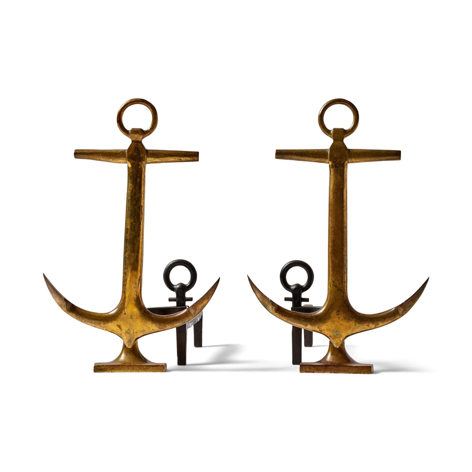 Pair of antique brass andirons in an anchor motif.