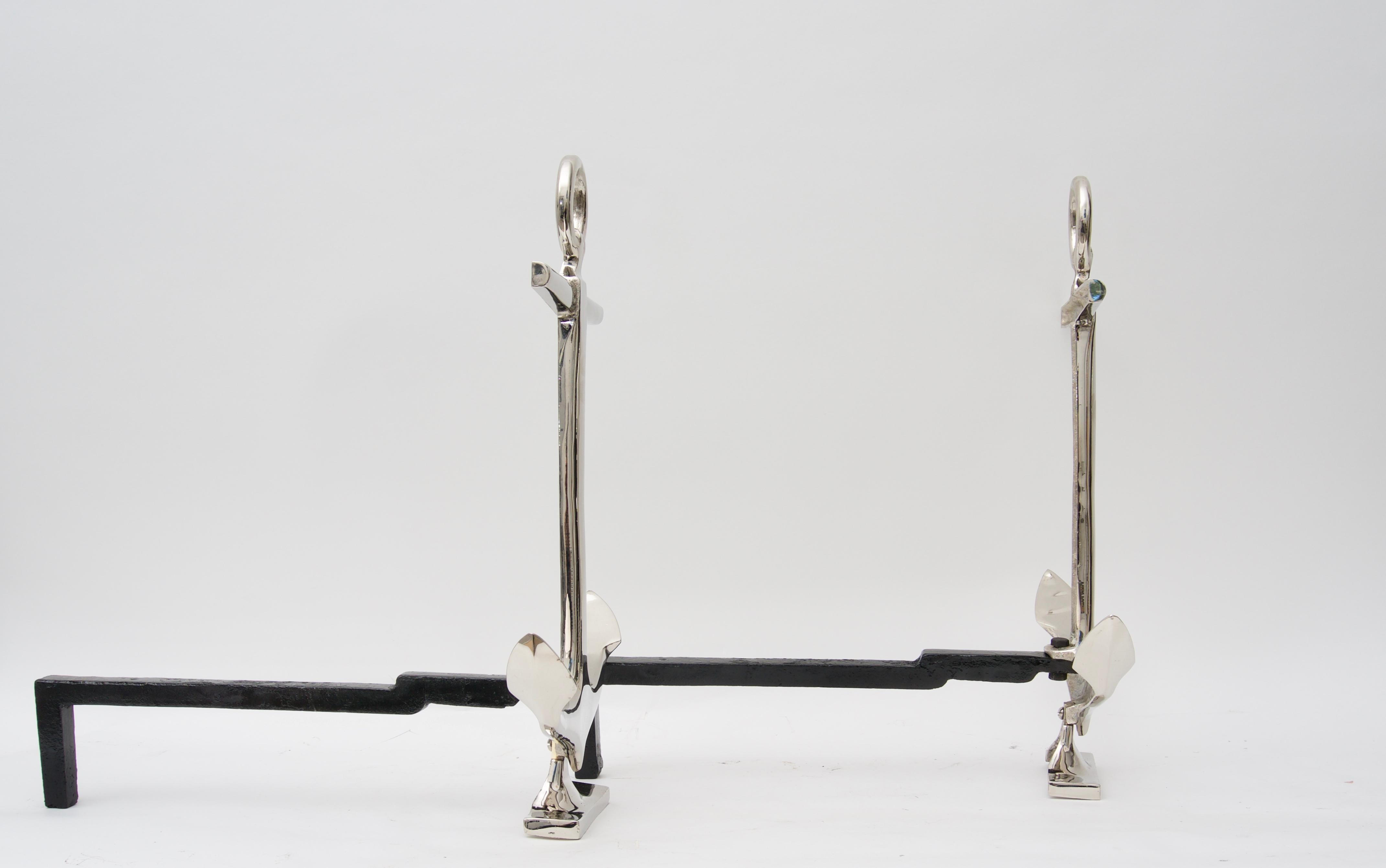 This stylish pair of andirons date the 1930s-1940s and have been professionally nickel-plated recently for a very clean, modern and stylish look.

 