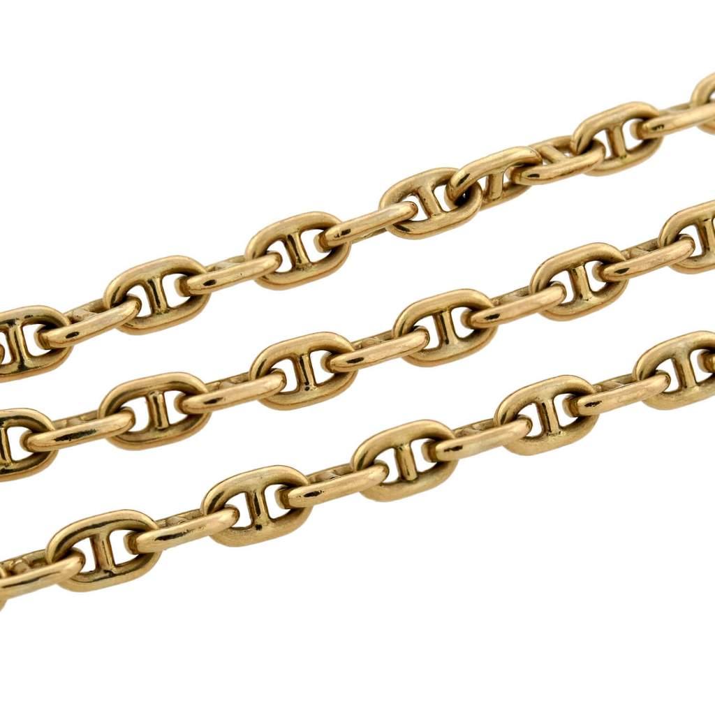 A fashionable Vintage chain necklace from the 1970s era! This classic yet bold piece is crafted in solid 9kt yellow gold and comprised of interlocking anchor links (also known as mariner links) that come together to form a long flowing chain. The