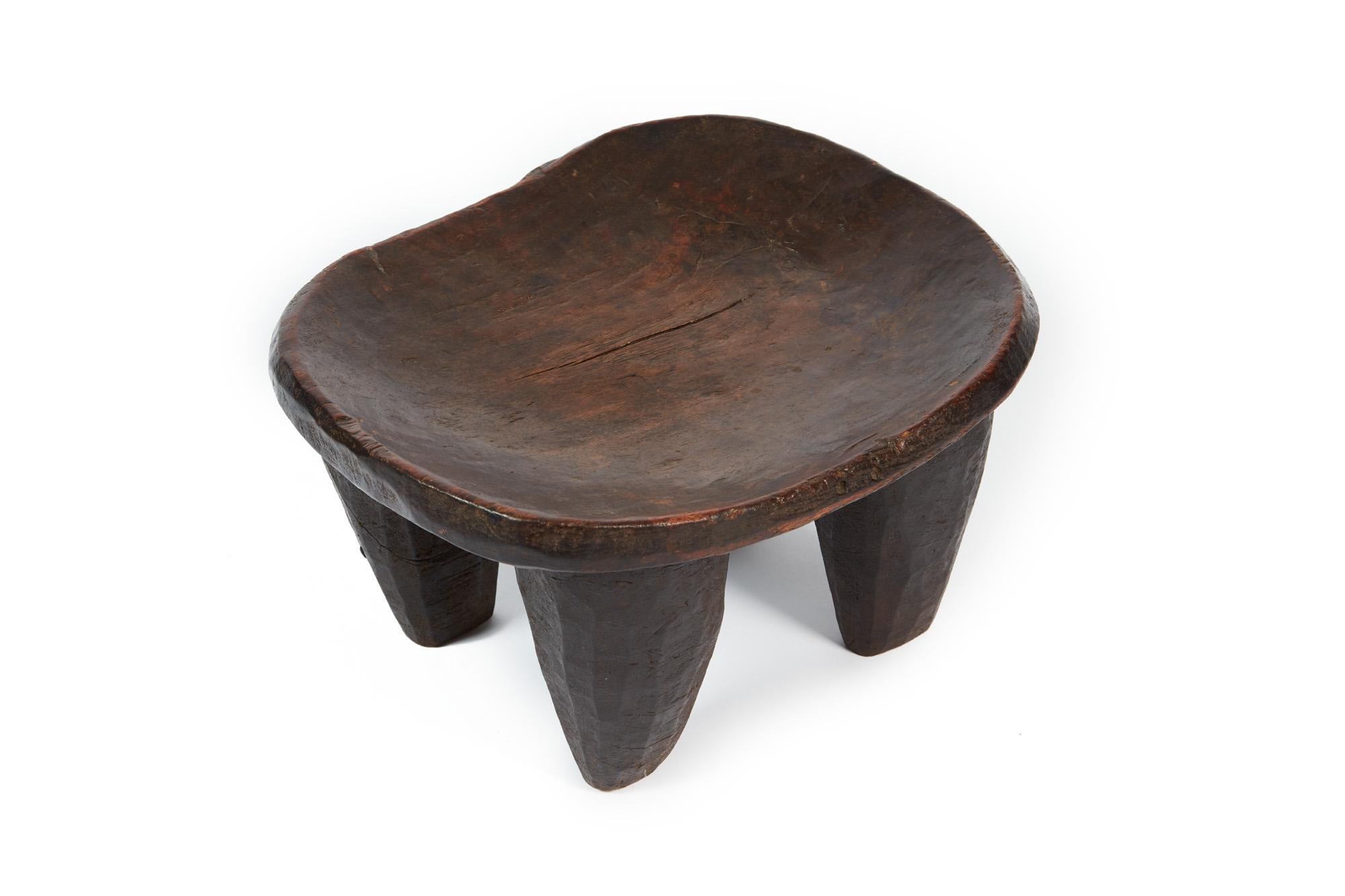 Ancient wooden stool with four feet dating to the 19th century. From Congo, Africa.
Provenance: Galerie Démons et Merveilles, Paris; Private Collection, United Kingdom.