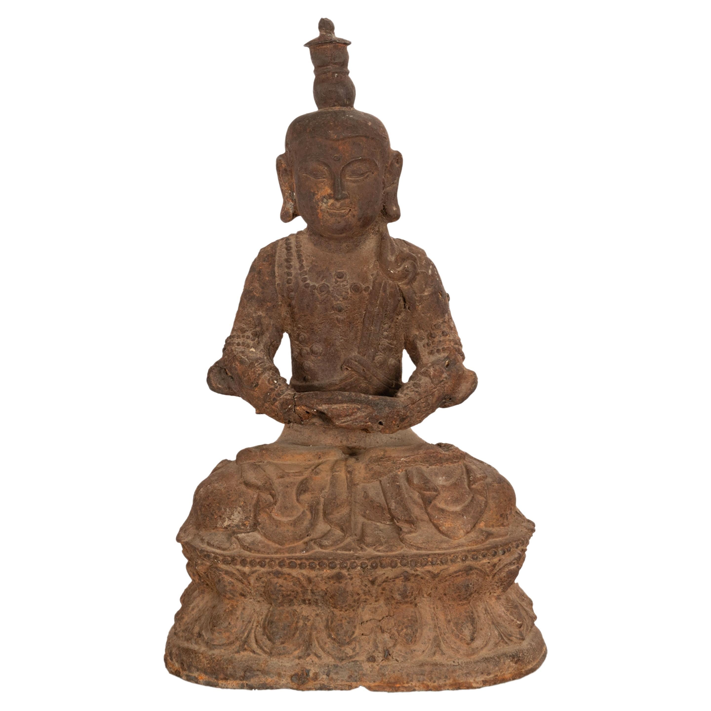 A rare & large ancient Chinese Ming Dynasty cast iron Buddha statue, 14th century.
The Buddha seated in a meditative dhyanasana pose with downcast eyes and with hands in dhyana mudra and seated upon a double lotus throne, the Buddha with a tall