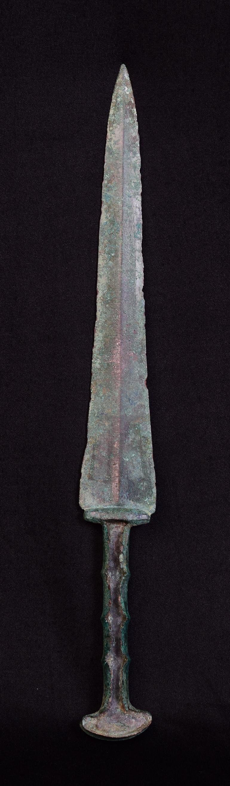 Ancient Luristan bronze short sword with green patina.

Luristan bronze comes from the province of Lorestan, a region of nowadays Western Iran in the Zagros Mountains. With its rich and long history, Luristan culture is well-known for its