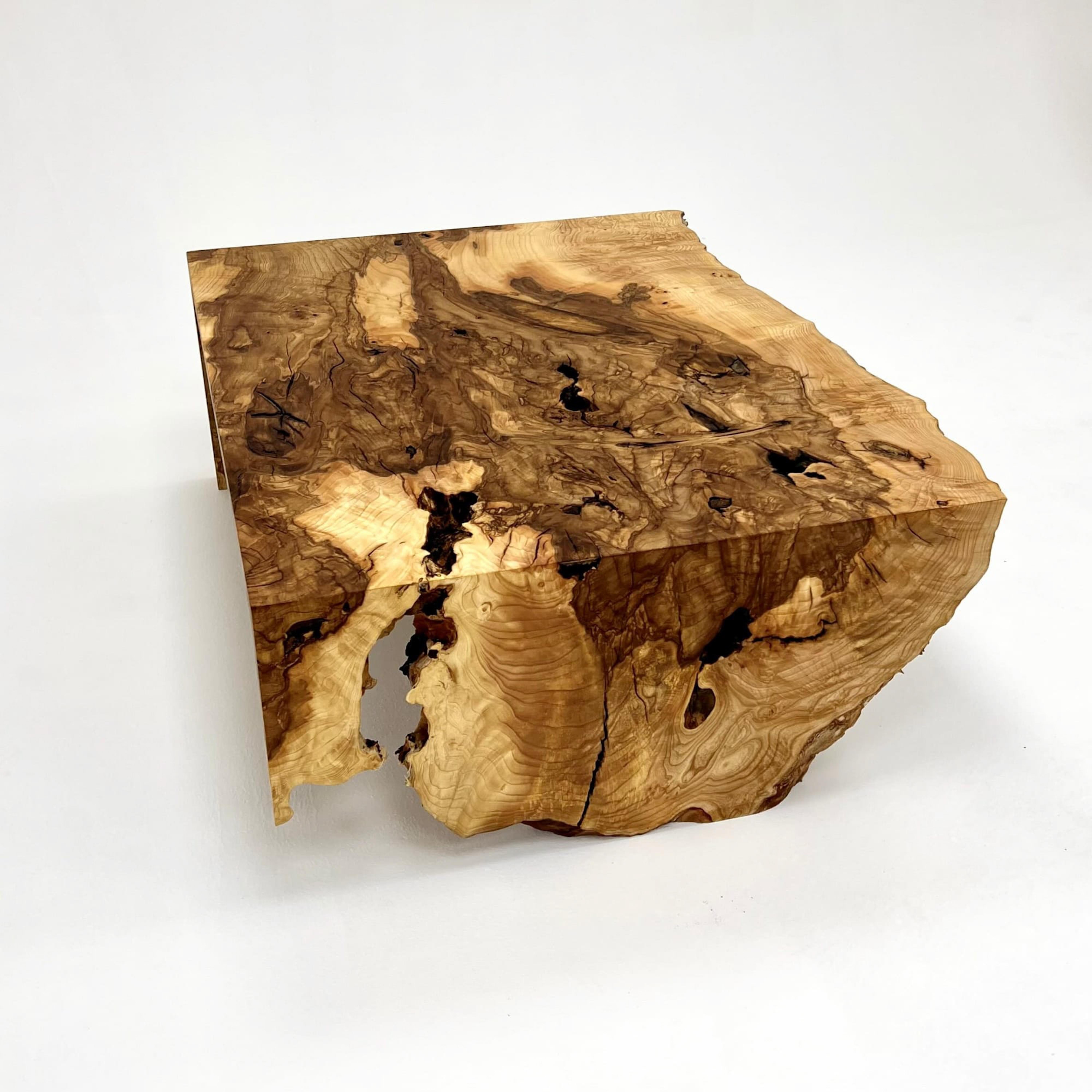 Ash Wood Coffee Table

Handcrafted by skilled artisans of Tinella Team, this coffee table seamlessly fuses natural wood with smoke epoxy resin, creating a captivating piece that captures nature's beauty. 
Its exceptional design and craftsmanship