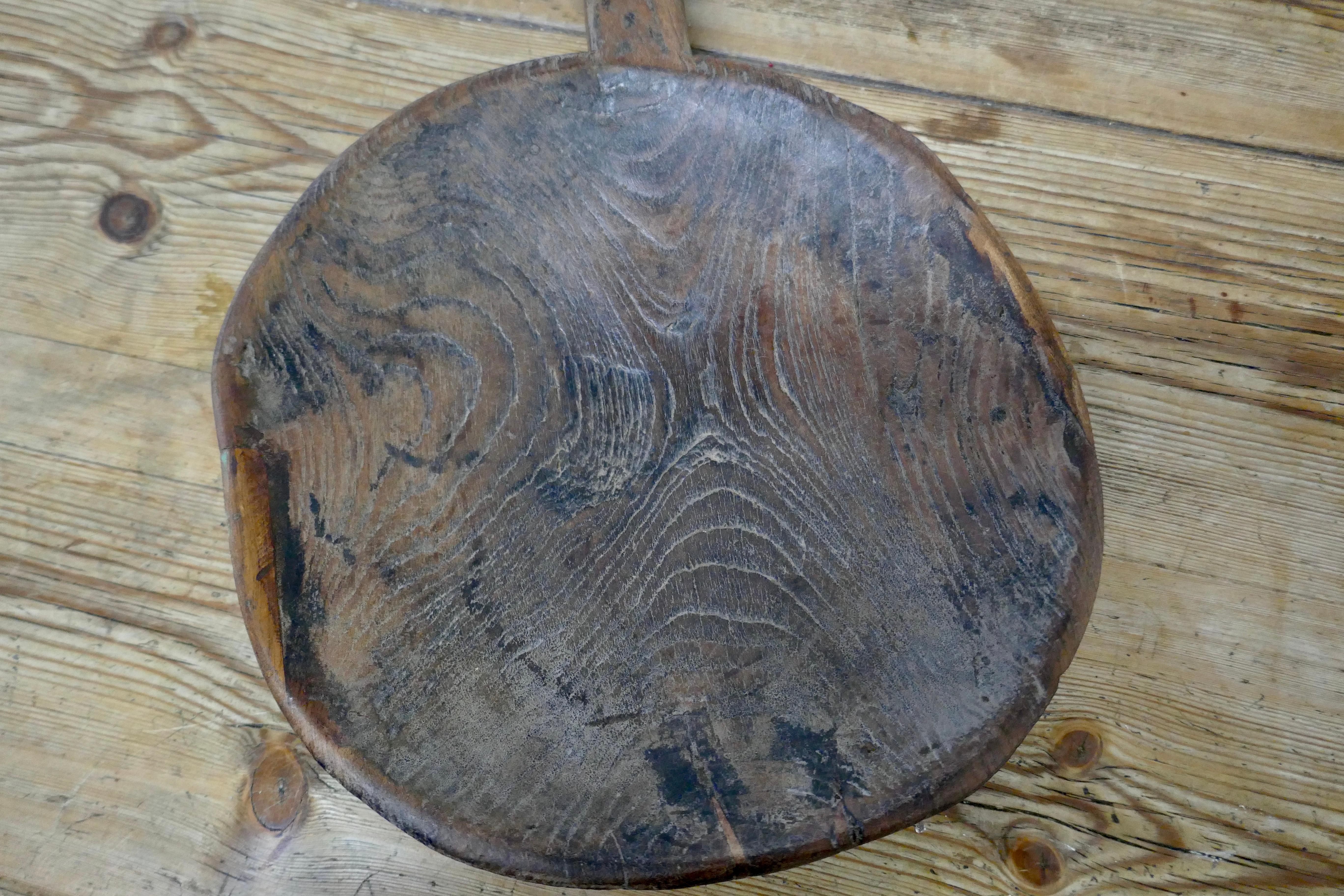 Ancient Asian grain scoop bowl

A tactile and lovely looking piece the bowl has a handle, it is made from a single piece of wood, it has flat bottom, a small piece of wood has been let in on one side, the sis all part of its authenticity and