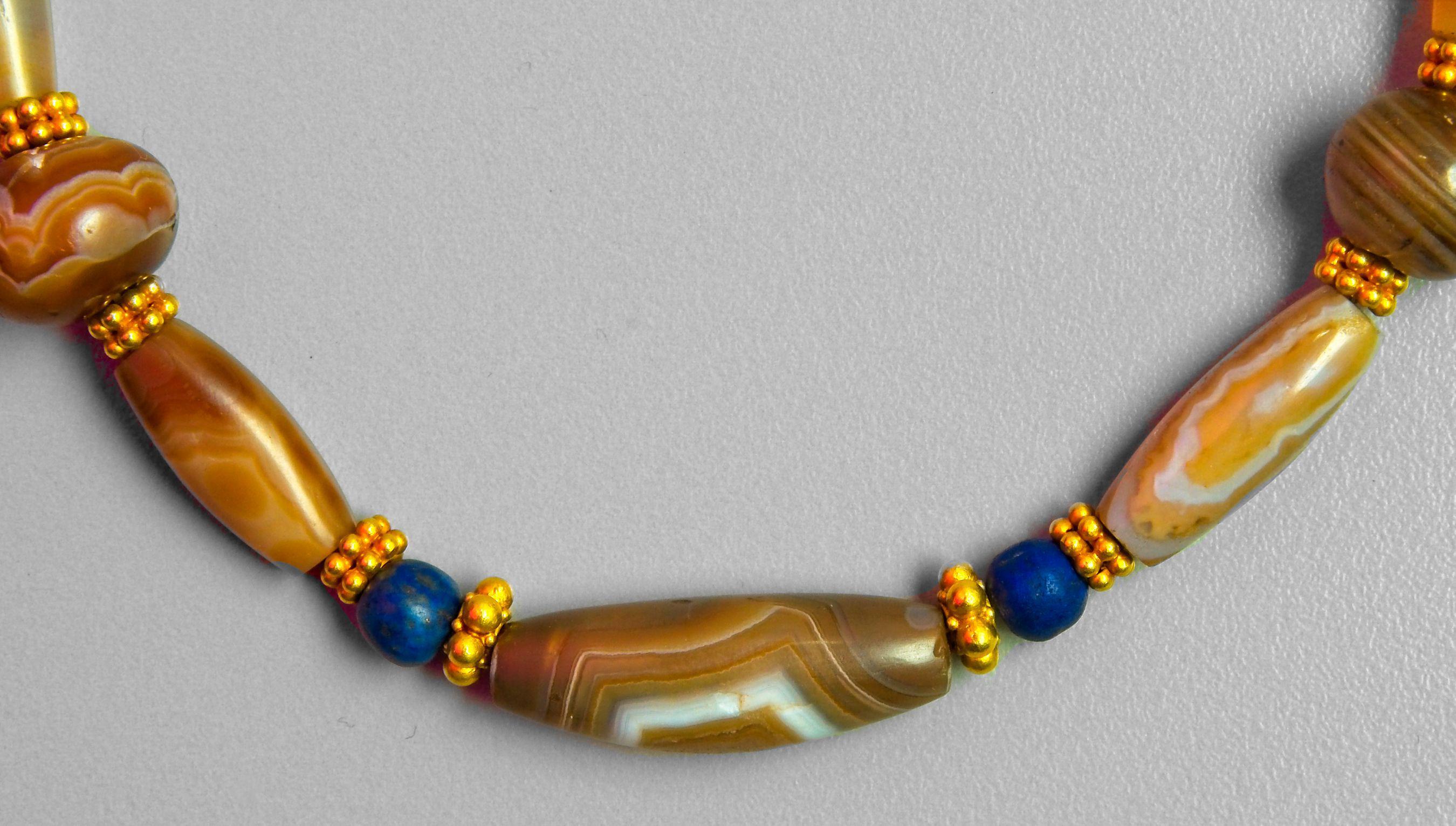 Ancient gold and agate beads from the period of the reign of Sennacherib, the king of ancient Assyria (704-681 B.C.). There are seventeen agate and agate/carnelian beads, four lapis lazuli beads and twenty ancient gold beads. The clasp is the only
