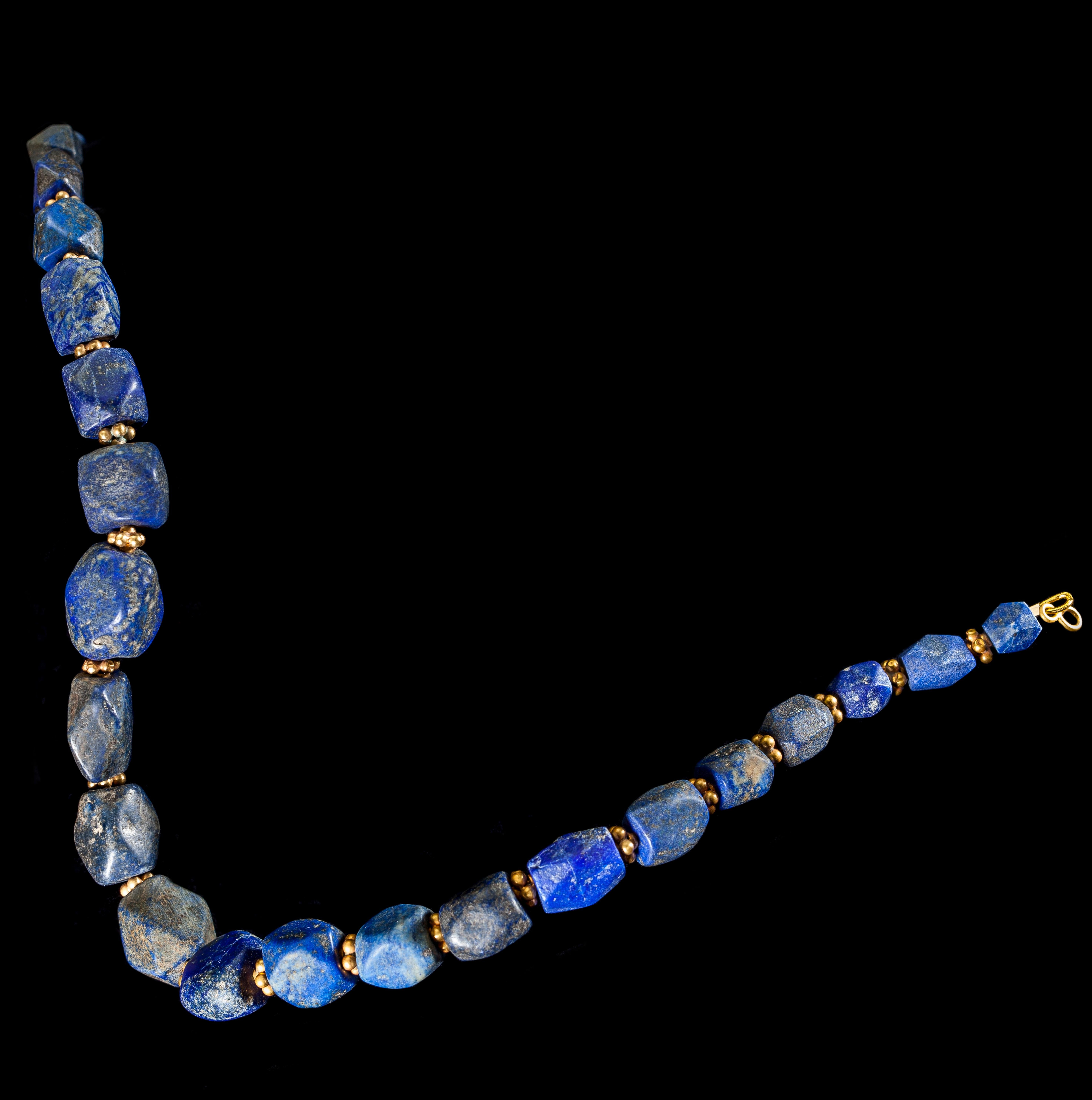 Bactrian culture spread across a wide area of modern-day Afghanistan and Uzbekistan and reached its zenith between 2100 and 1700 B.C. It produced many unique and distinctive objects and jewellery. This necklace has striking blue Lapis Lazuli stone