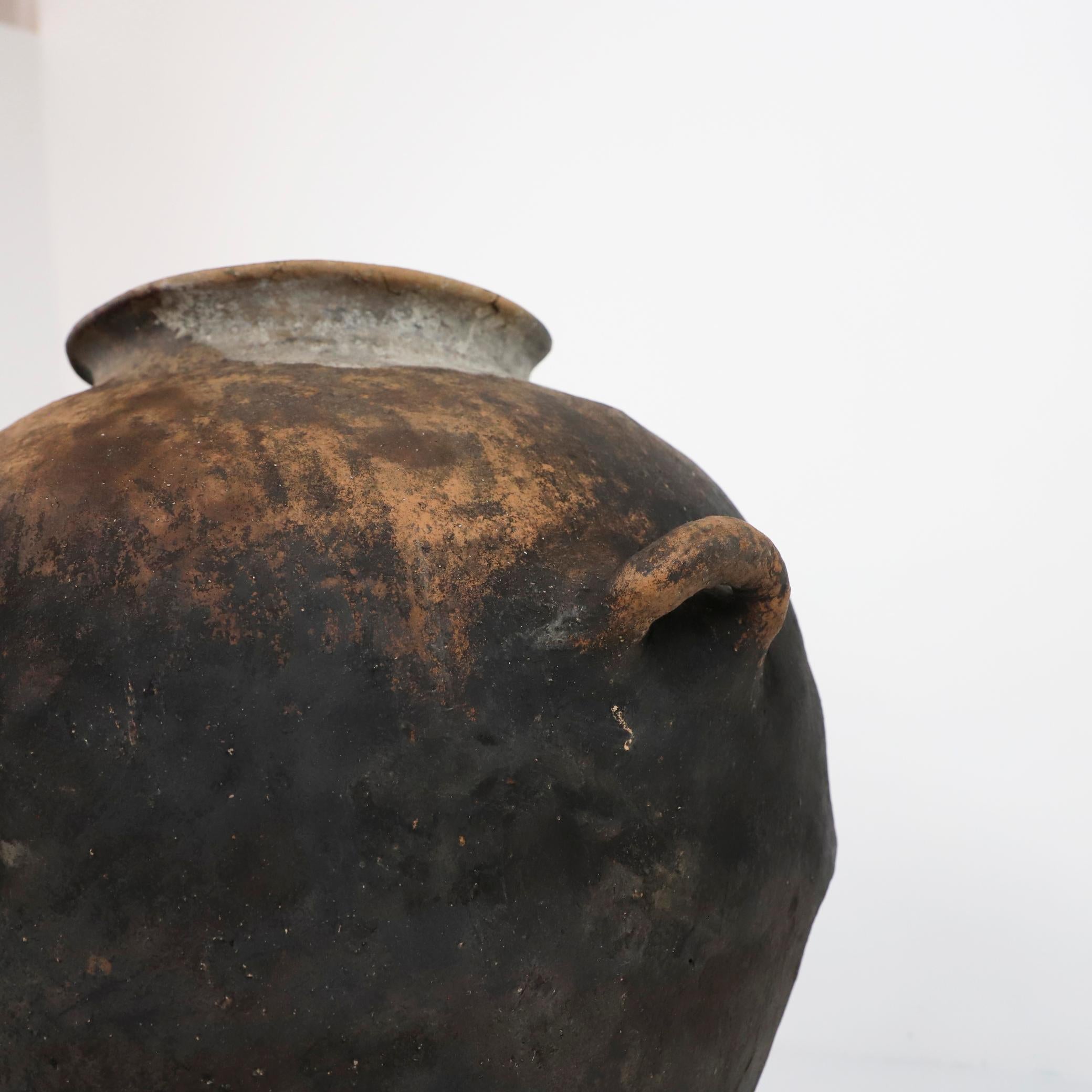 Circa 1940, We offer this fantastic ancient barro pot from Mexico, made in Puebla México hand crafted. This style of pottery is very rare, originally used for storing water from nearby rivers.