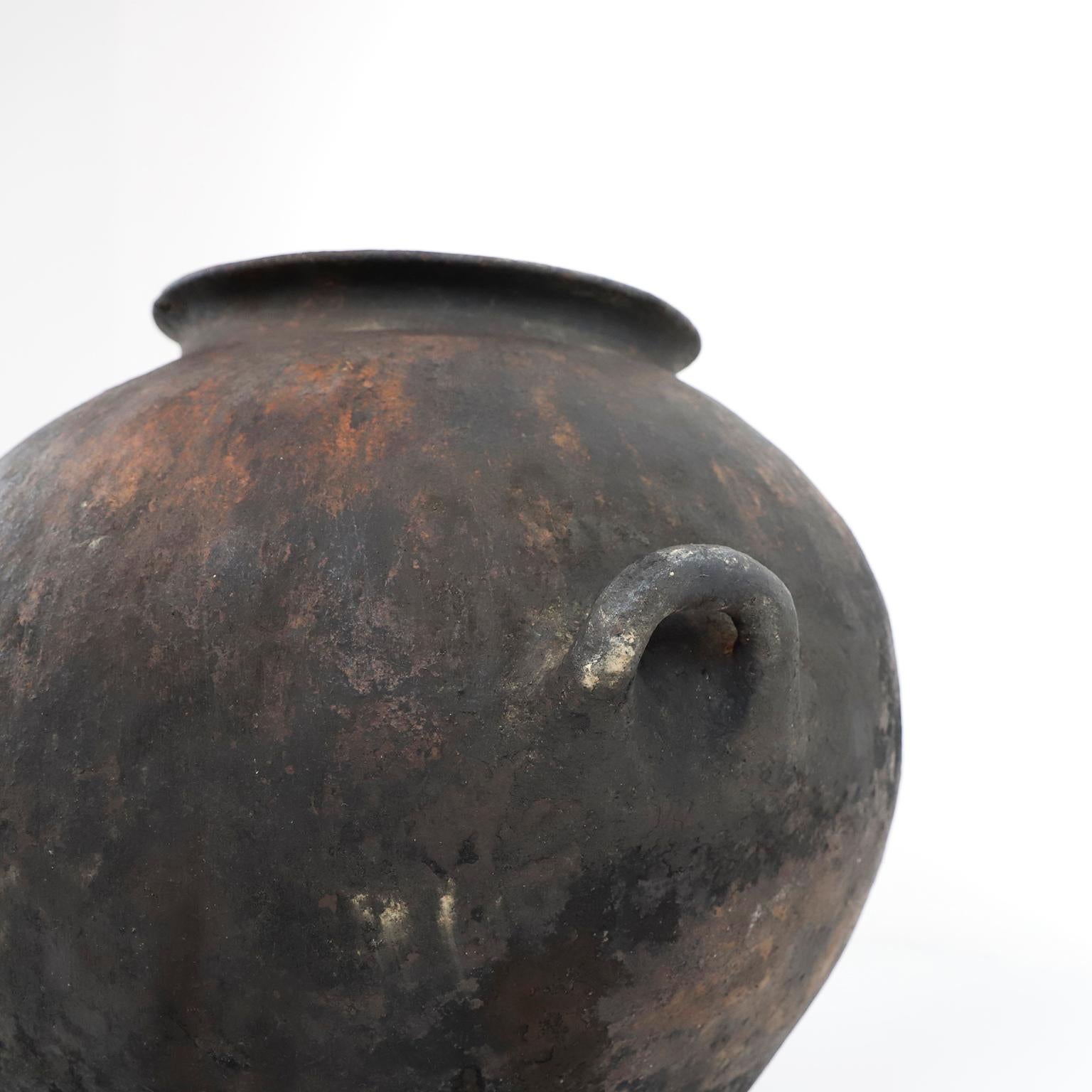 Circa 1940, we offer this fantastic ancient barro pot from Mexico, made in Puebla México hand crafted . This style of pottery is very rare, originally used for storing water from nearby rivers. One lug of the pot is broken.