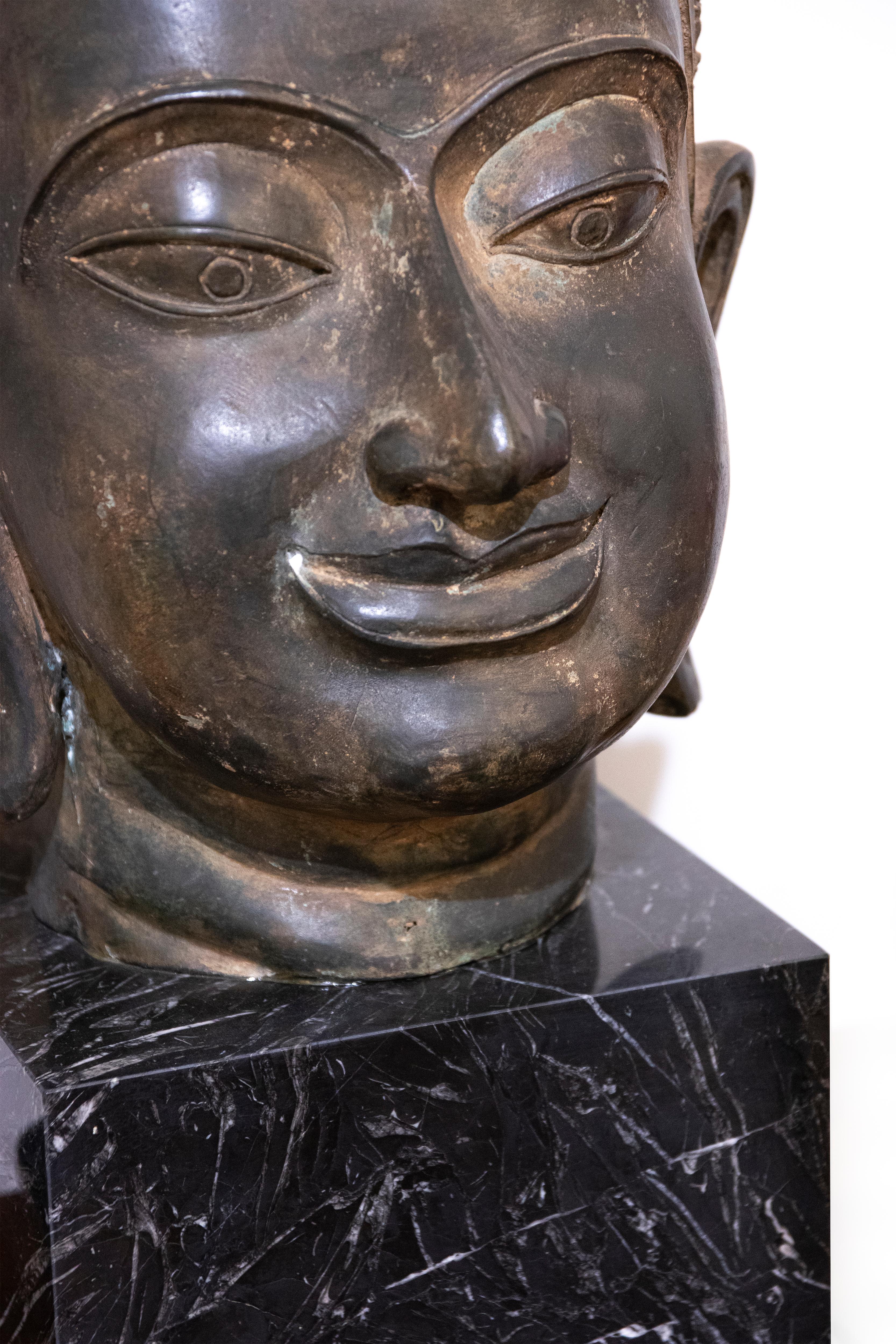 Beautiful ancient bronze head of Buddha, late 19th century.

Good conditions, it rests on a green marble base.

This artwork is shipped from Italy. Under existing legislation, any artwork in Italy created over 70 years ago by an artist who has