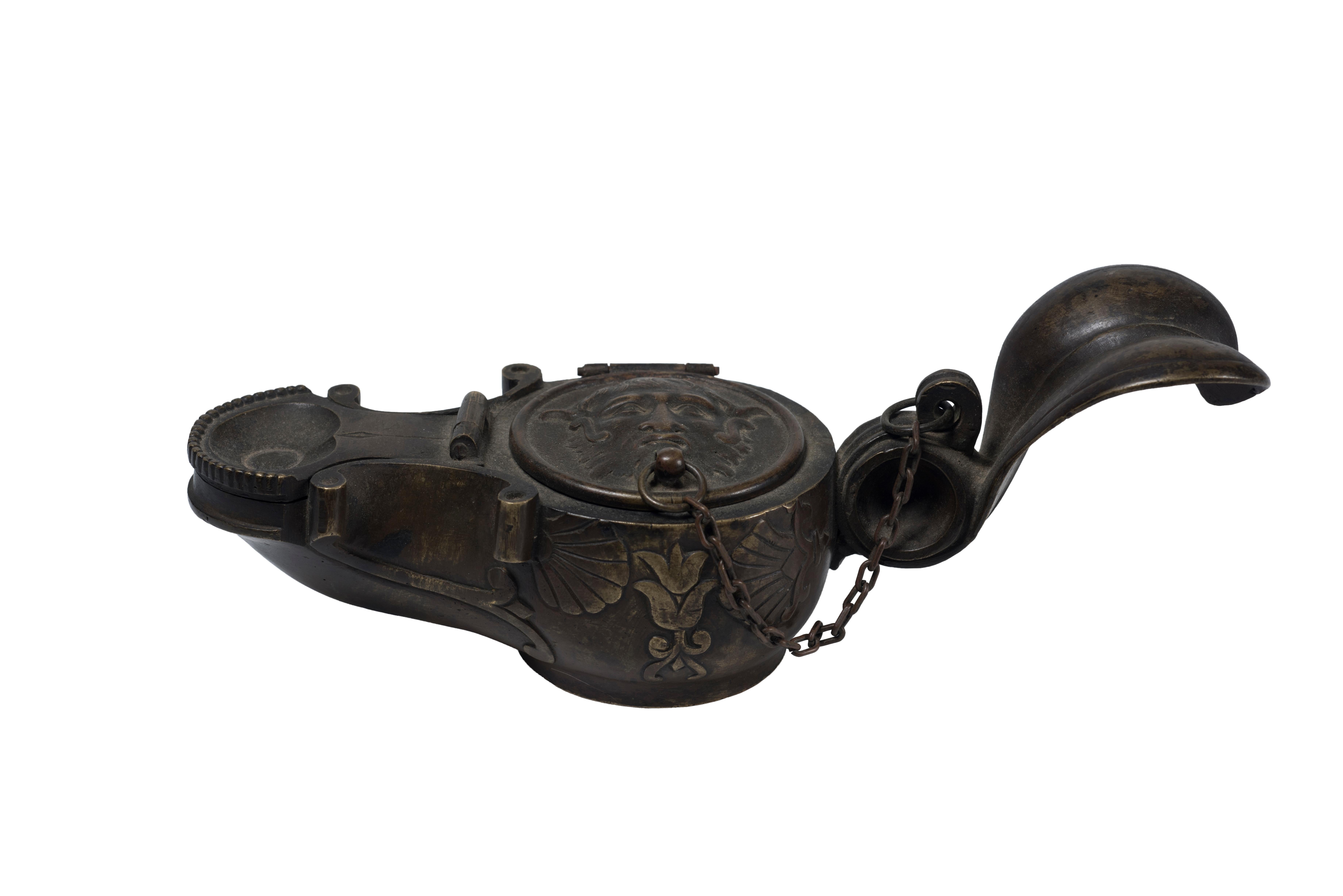 Oil Lamp is an original decorative object realized in Rome at the beginning of 1800.

After G. Winckelmann’s Lamp (found in Pompeii).

This elegant lamp was used as a bronze inkwell.

Very good conditions.

This object is shipped from Italy.