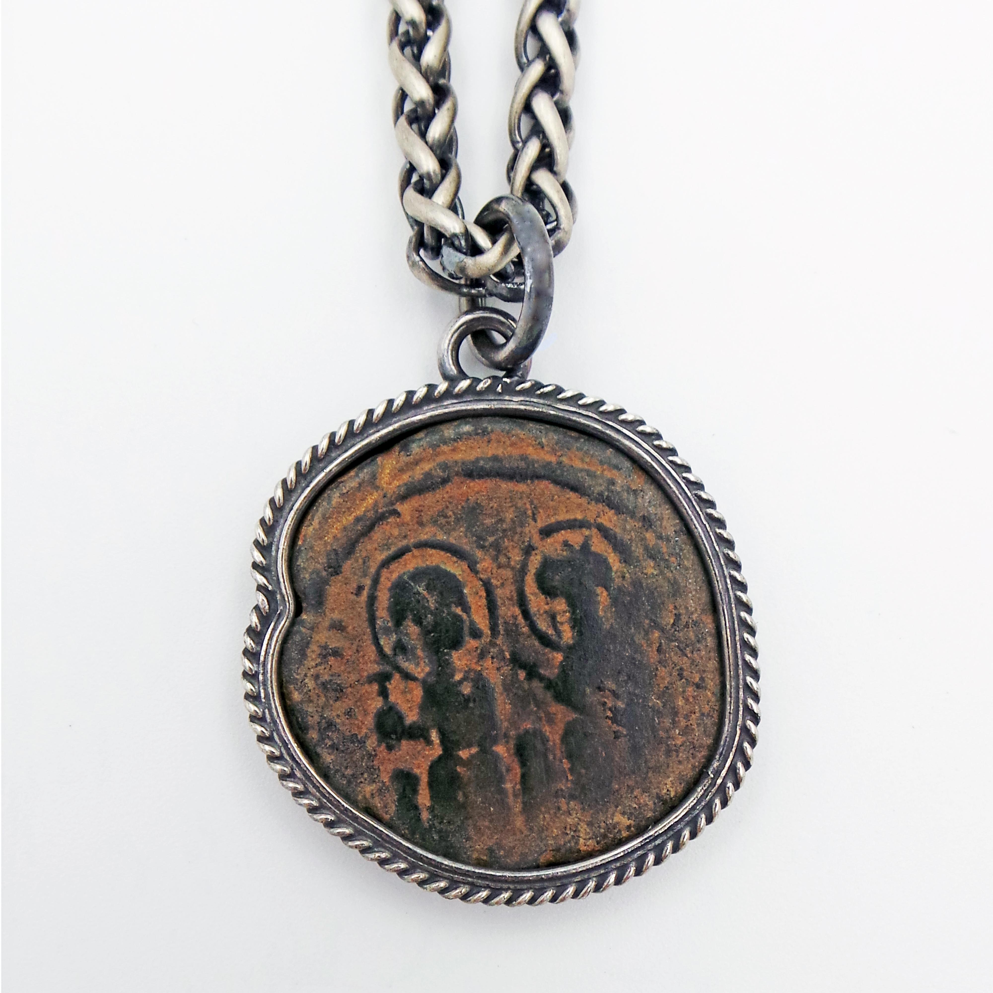 Ancient Byzantine bronze coin (Justin II and Queen Sophia, Follis, 565-578 AD) set in an oxidized sterling silver rope bezel pendant on a brushed wheat chain necklace. 