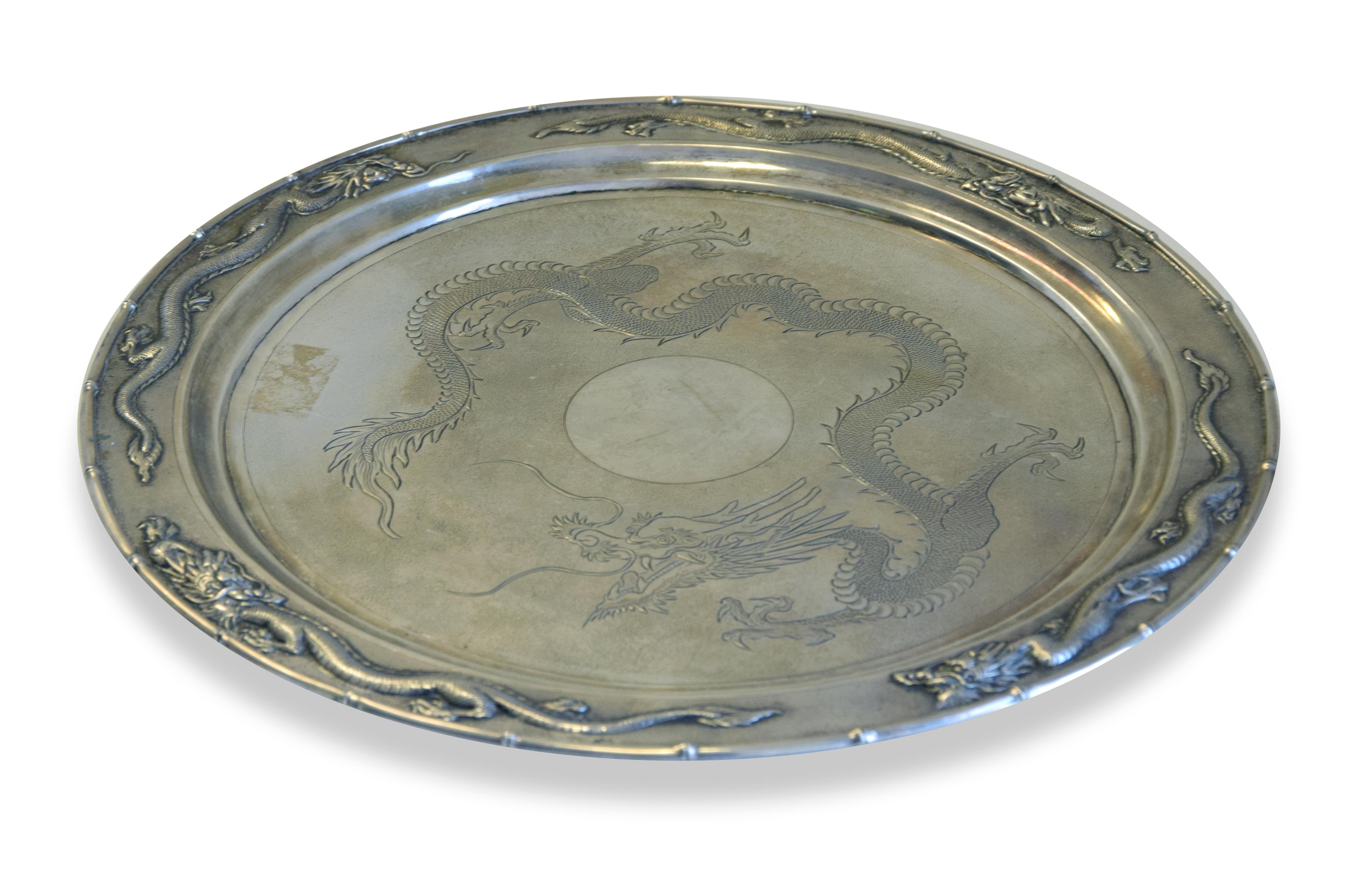 Chinese silver tray is an original decorative object realized in China between 1870 and 1930.

Original silver object.

Hallmark Shangai, silversmith QI CHANG 其昌

Titled 800/1000.

Ø 35 cm 

Mint conditions.

Precious Antique silver tray made by QI