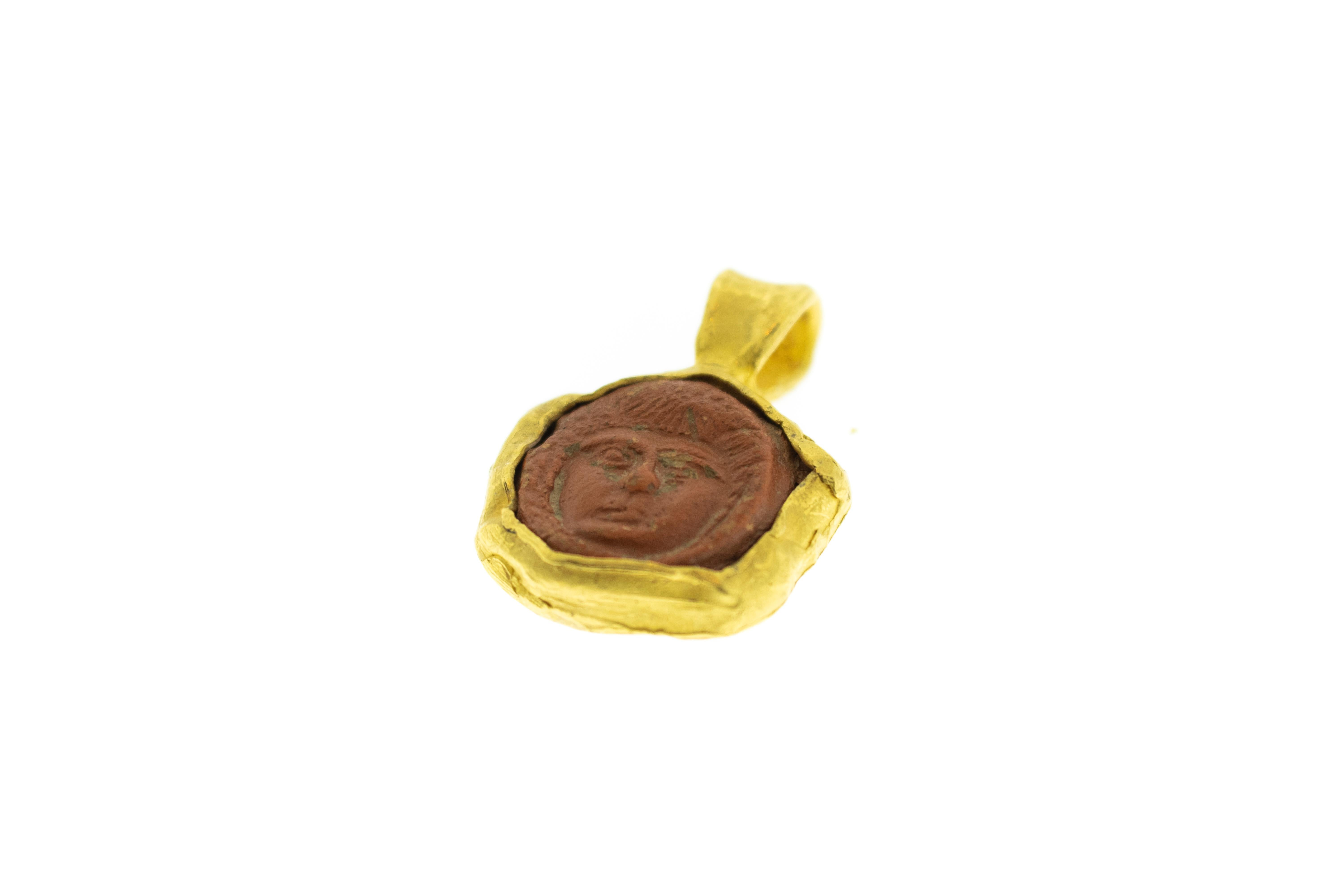 Ancient Clay Artifact Mounted in 22k Gold Pendant. Total weight 26.55 grams. Height 1.5 inches Width 1 inch