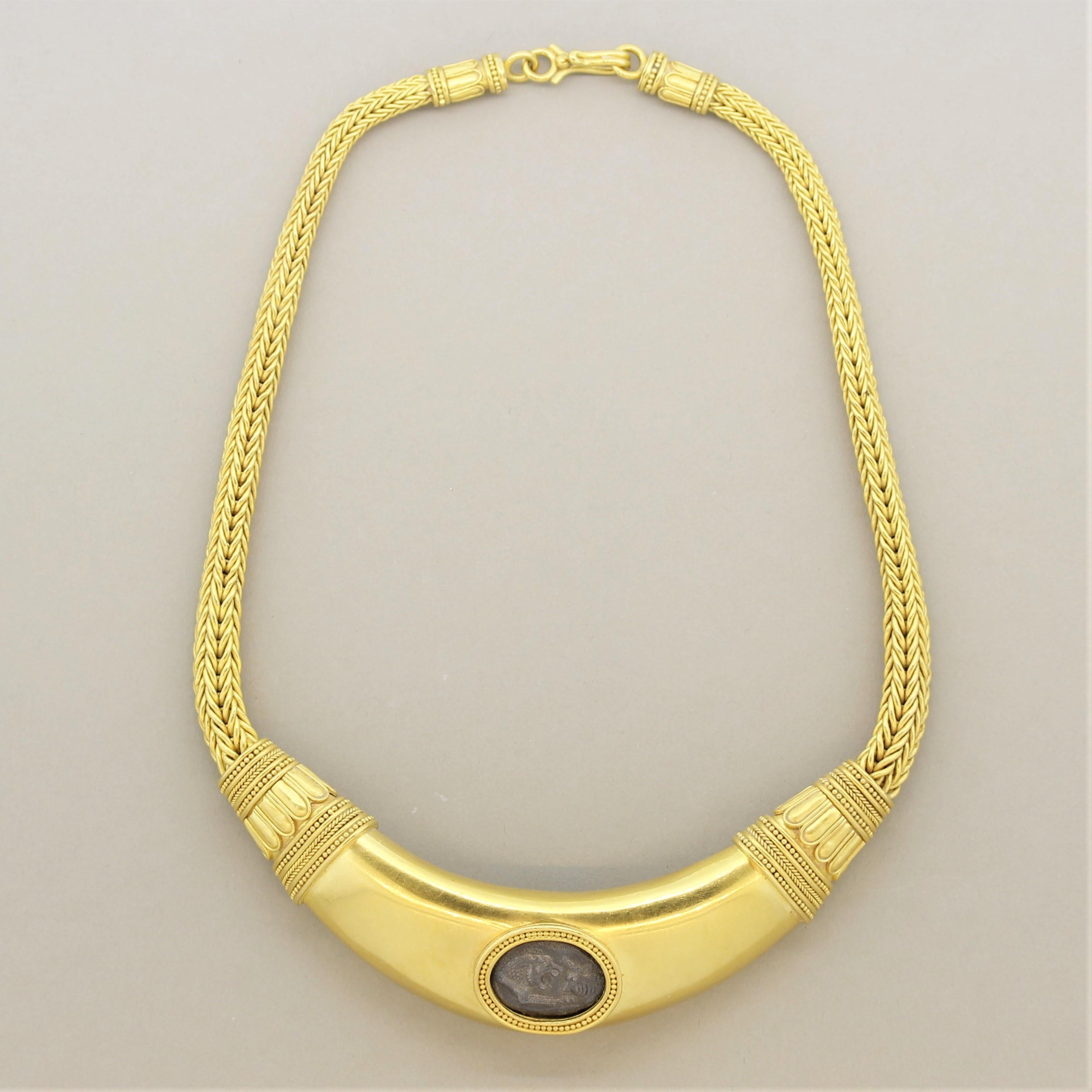 A modern necklace which includes a true ancient coin over 2,000 years old from the King Croseus dynasty, circa 550 BCE. The necklace is designed in an antique style with twisted and braided gold chains as well as hand carved gold accents. Made in