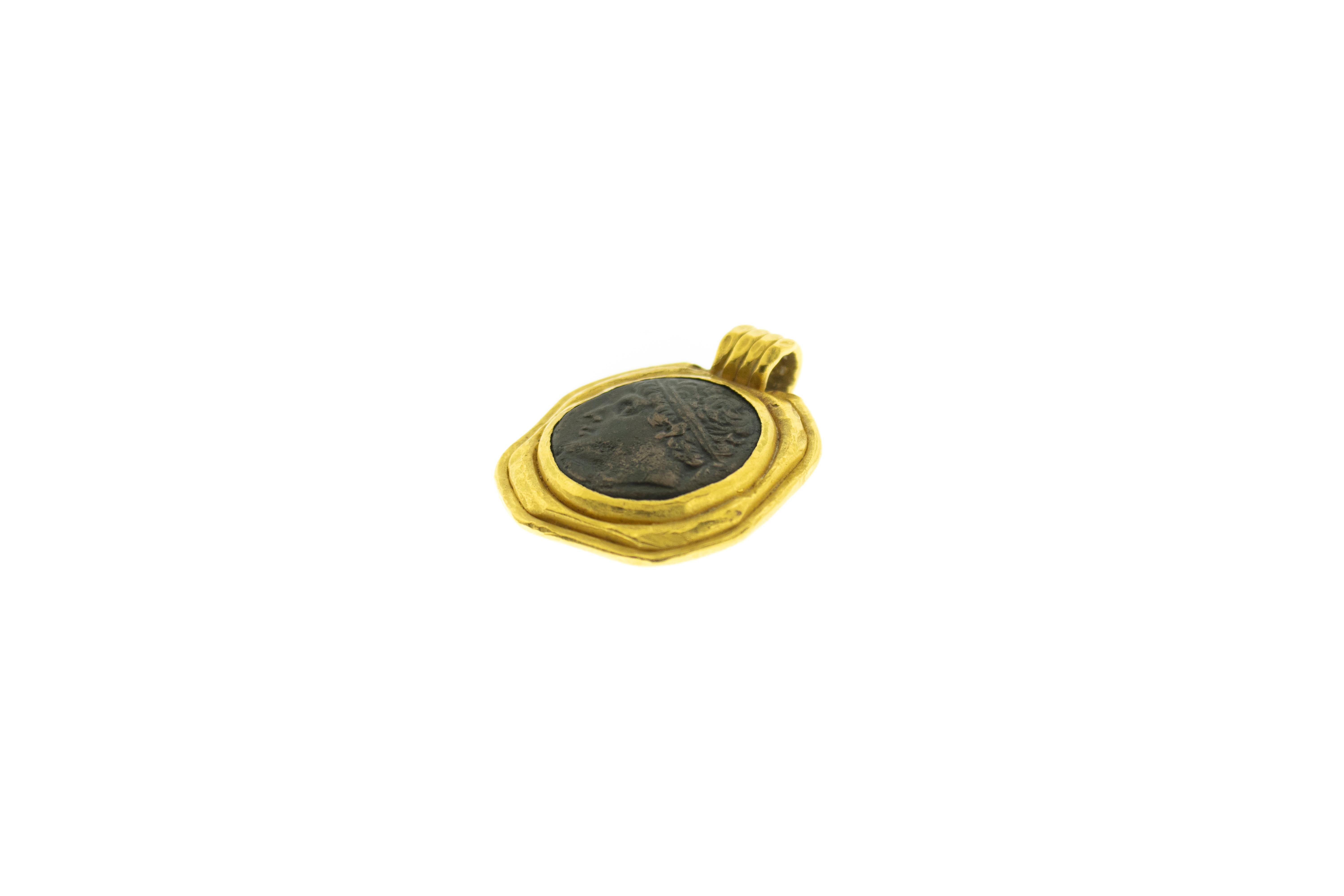Ancient Artifact Mounted in 22k Gold Pendant. Ancient Grecian or Roman coin mounted in 22k Gold. Total weight 47.45 grams. 22k Gold casing was not made in ancient time. Height 1.75 inches Width 1.5