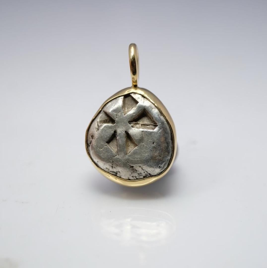 I've wanted to buy this ancient coins for about a decade and I finally did. It's a stunning, thick 12.15 grams silver coin from 500 BC showing a turtle and incuse pattern on the back. 

To appreciate its size, the relief of the coin and the shape of