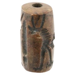 Ancient Cylinder Seal Carved From Brown Stone
