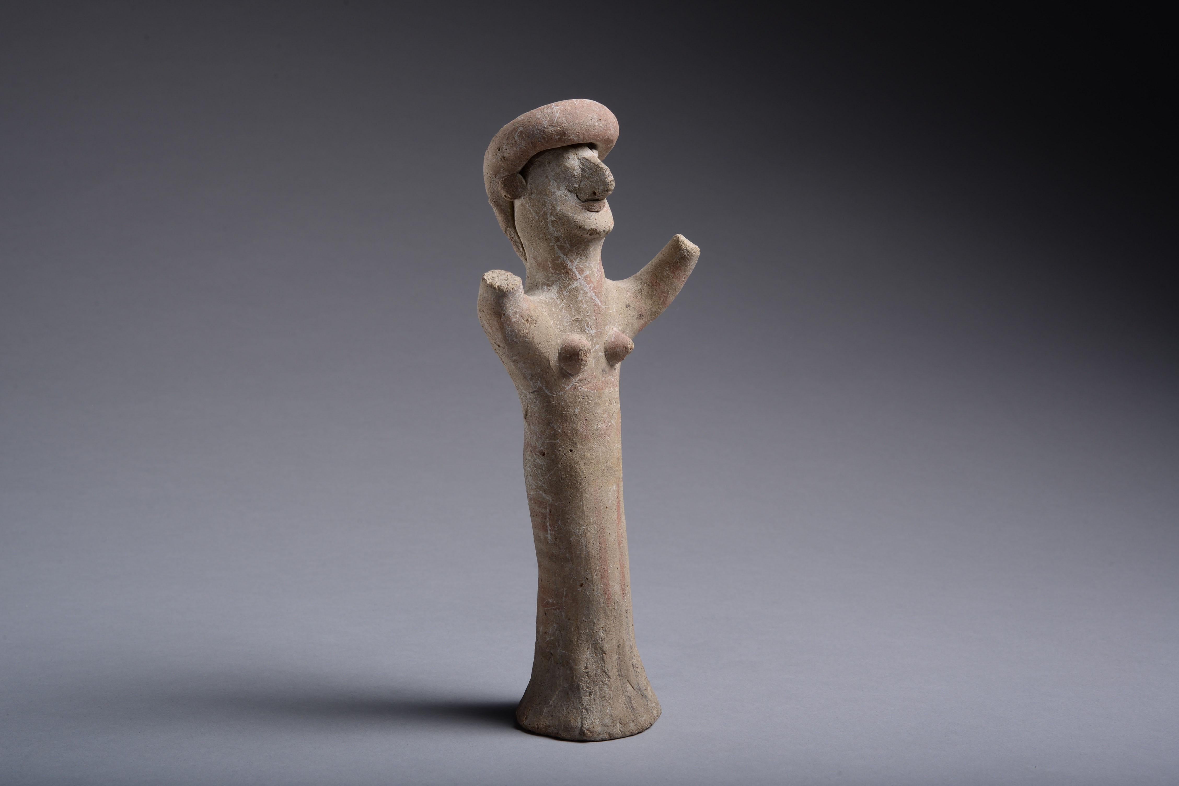 This confidently made statue depicts a goddess with raised arms, of a type normally found in fragments or overpainted.

The production of such figurines flourished during the Archaic period. Echoing Cyprus’s location as a meeting place between East
