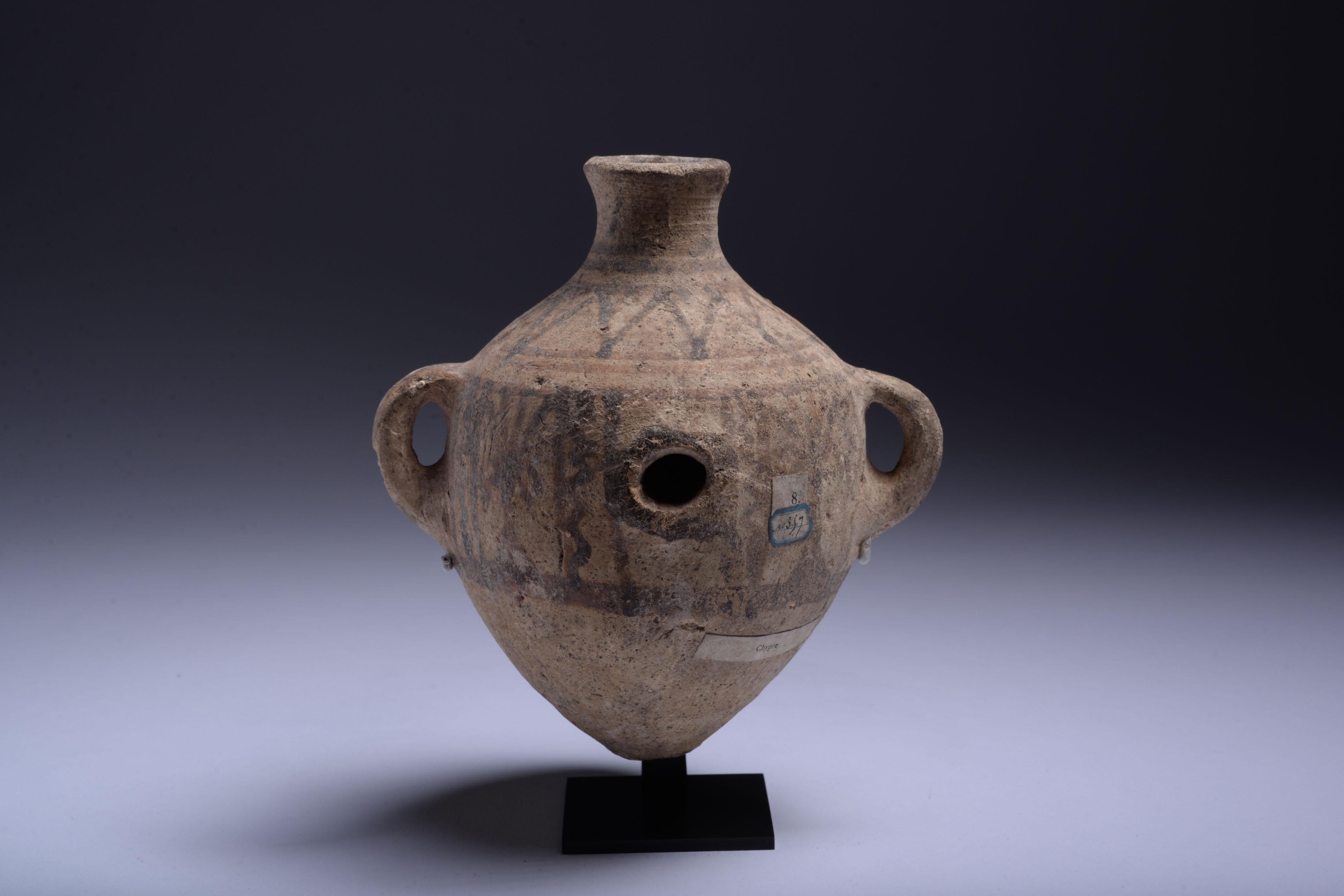 Cypriot Bronze Age Terracotta Vessel
circa 1850-1650 B.C.

Belonging to a style known as White Painted Ware, this attractive teardrop-shaped vessel is a prime example of the dynamism and playfulness that characterises the works of the ancient