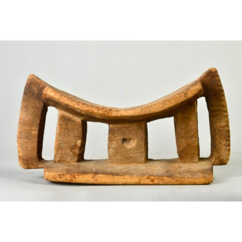 Ancient Dogon/Tellem headrest in wood

Ancient zoomorphic headrest with five pillars. This funerary headrest with its cave patina would have been cached in a cave on the Bandiagara escarpment for centuries. According to the Met, “What little is