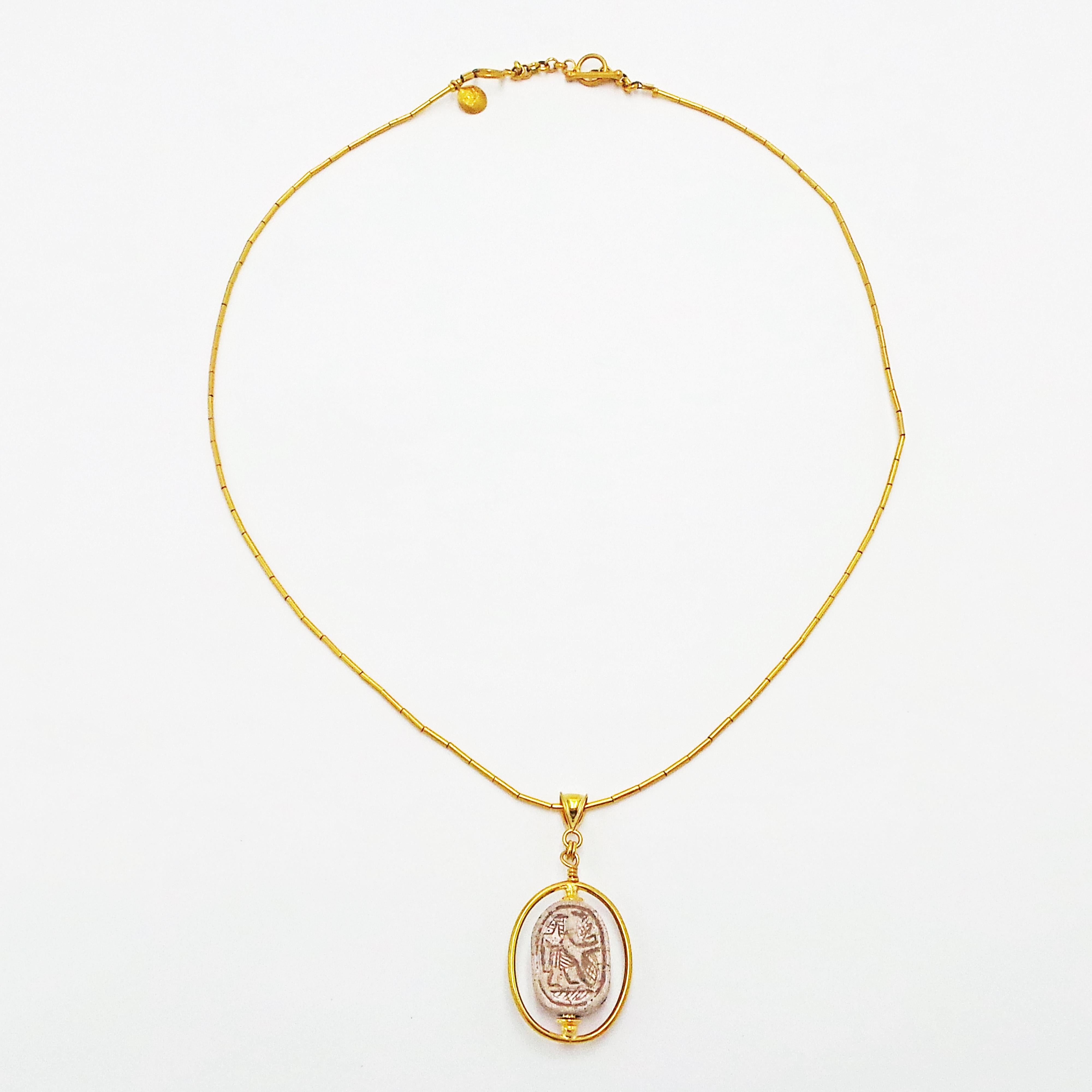 Authentic ancient Egyptian faïence Scarab (1000 BC) and 22k yellow gold spinner/reversible pendant on a 22k yellow gold tube link necklace.