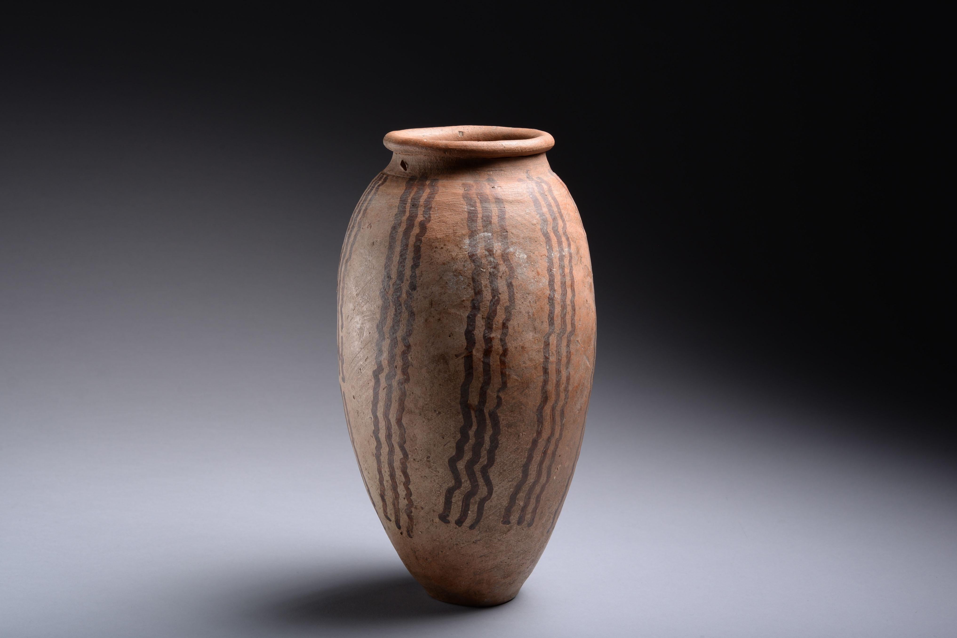 This beautifully preserved Predynastic jar dating to the Naqada II period was crafted without a wheel, and is a testament to its potter’s ability to create perfectly balanced vessels by hand. 

It was made at a time of intensified urbanisation,