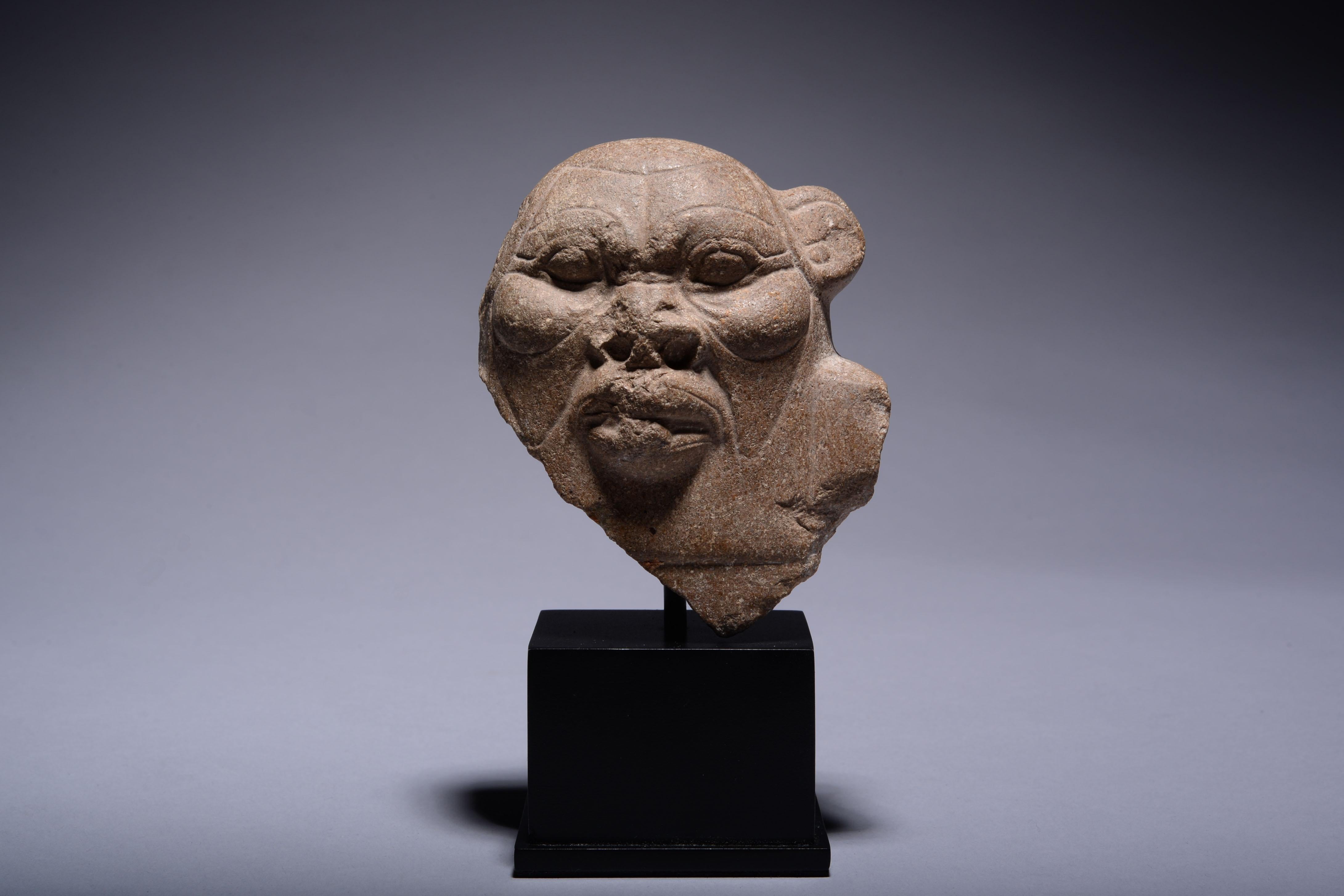 Quartzite bust of Bes, guardian of the household, patron of childbirth and god of war. Dating to Egypt's Ptolemaic Period, circa 332 - 30 BC. 

The rounded head with large, oval eyes, prominent cheeks and broad, furrowed brow. The wide nose with